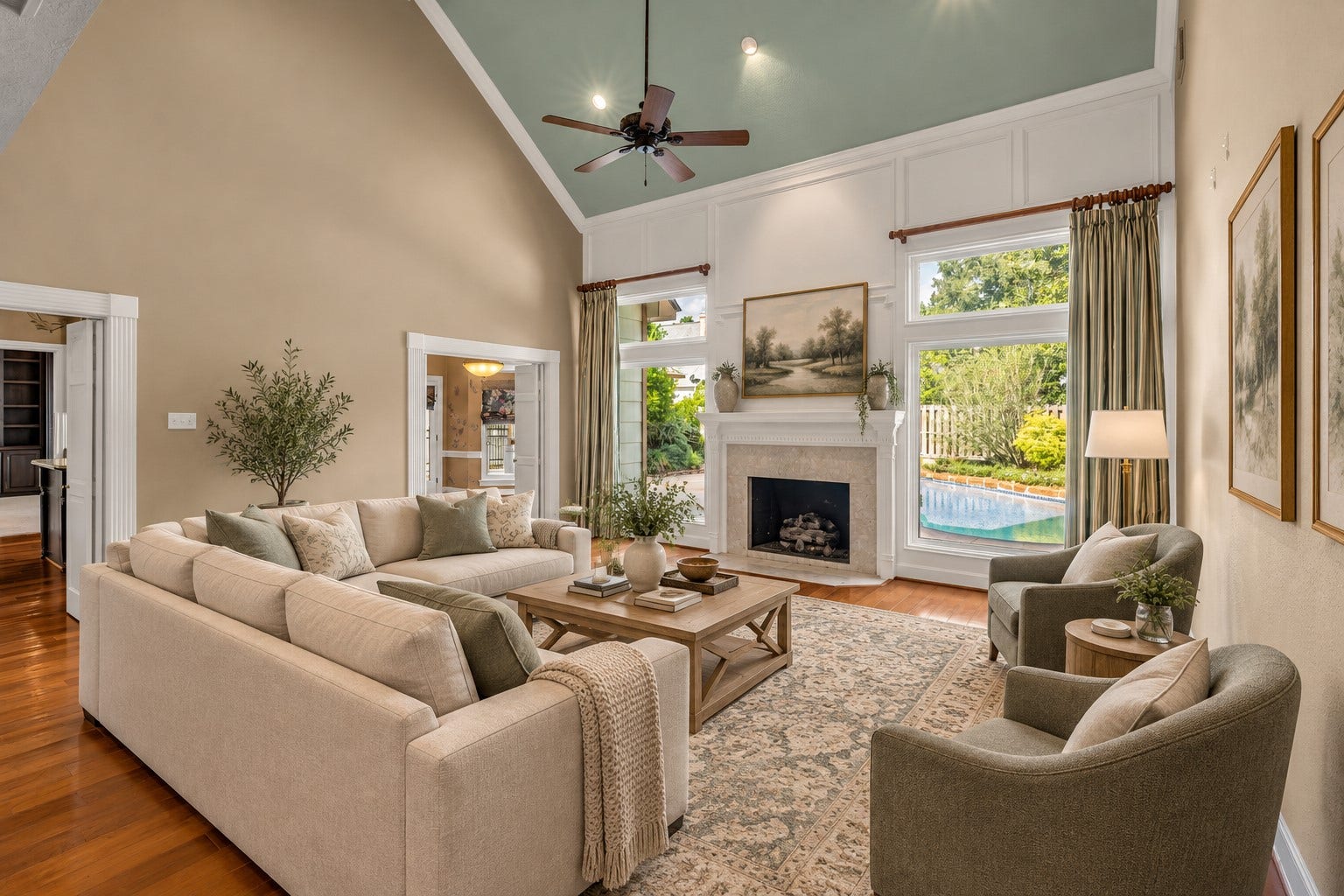 5907 Rocky Brook Drive, Houston, TX 77345 *VIRTUALLY STAGED* Two-story living room with fireplace and views of the private pool.