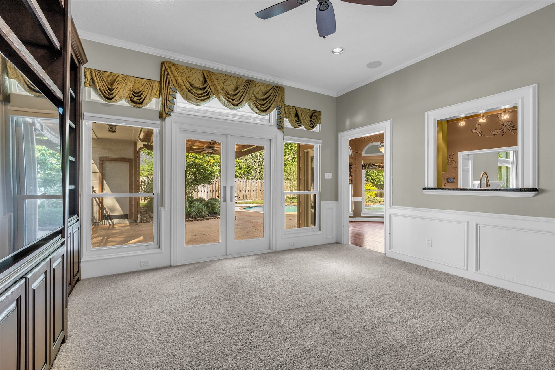 5907 Rocky Brook Drive, Houston, TX 77345 Separate den with entertainment center and access to the pool area.