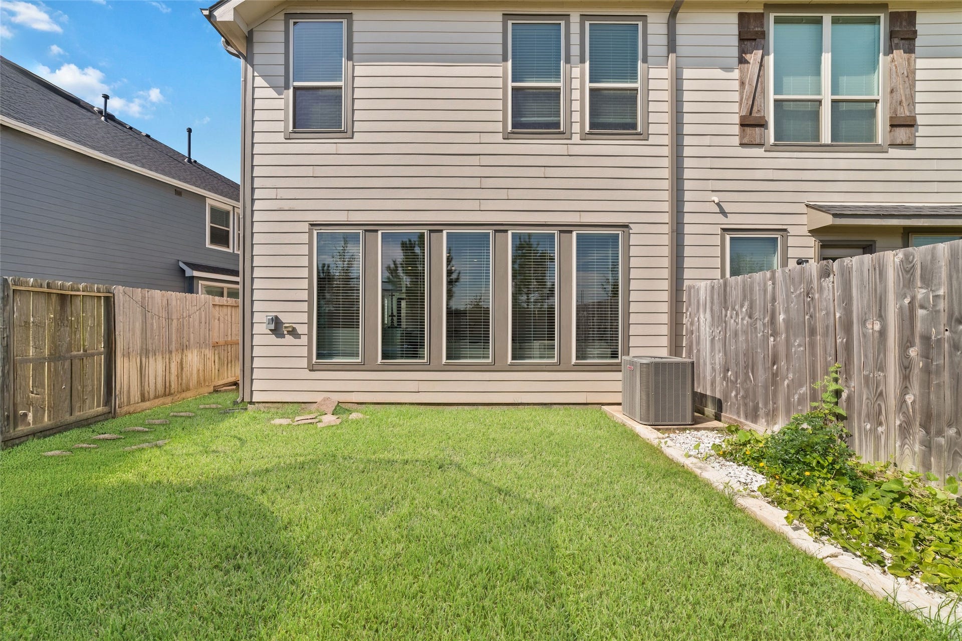5715 Foggy Vine Court, Fulshear, TX 77441 Enjoy a private fenced backyard with green space for outdoor relaxation, entertaining, or enjoying the Texas sunshine.