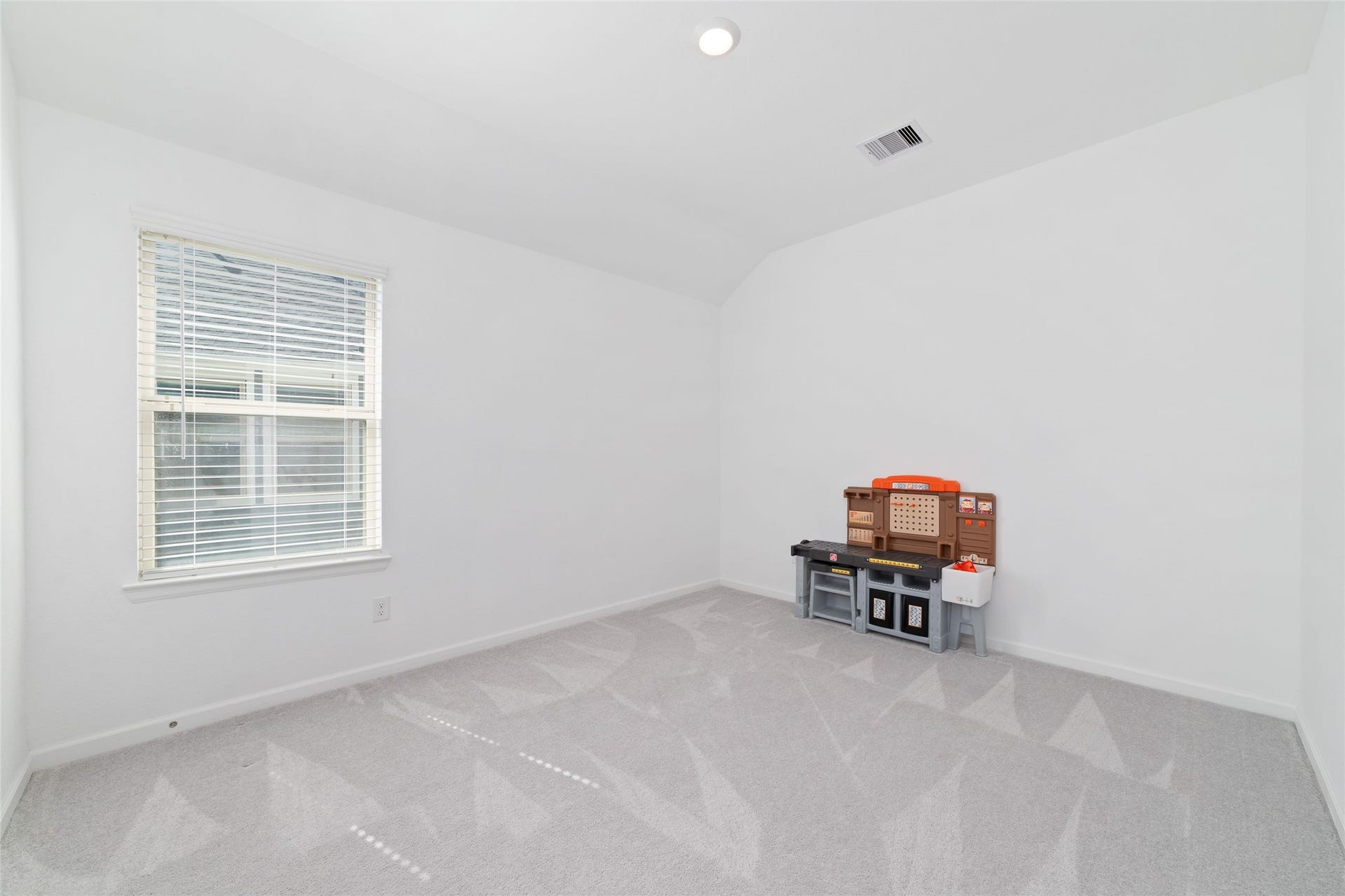 5715 Foggy Vine Court, Fulshear, TX 77441 The upstairs game room offers versatile additional living space, ideal for a media area, home office, playroom, or casual gathering space.
