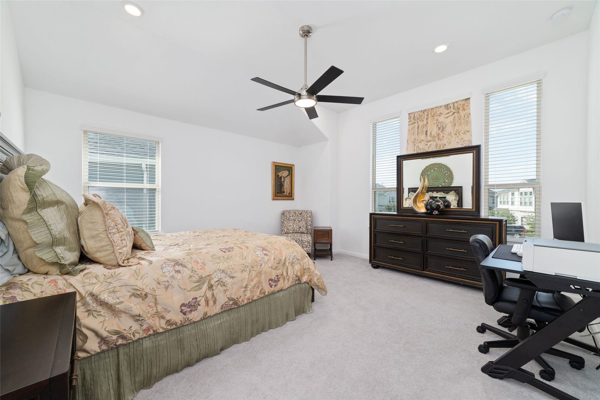 5715 Foggy Vine Court, Fulshear, TX 77441 Another view of the primary suite highlights its comfortable proportions, multiple windows, and inviting atmosphere.