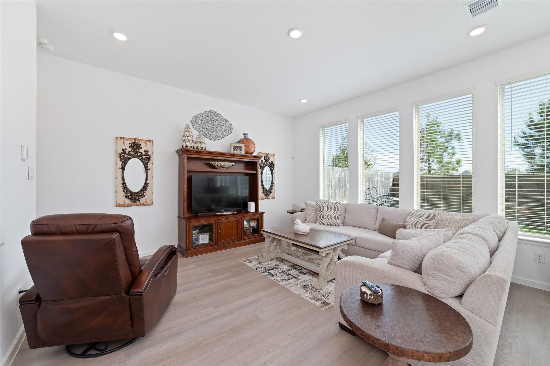5715 Foggy Vine Court, Fulshear, TX 77441 The inviting living area provides plenty of space for your favorite furnishings, with abundant natural light and a seamless connection to the dining area.