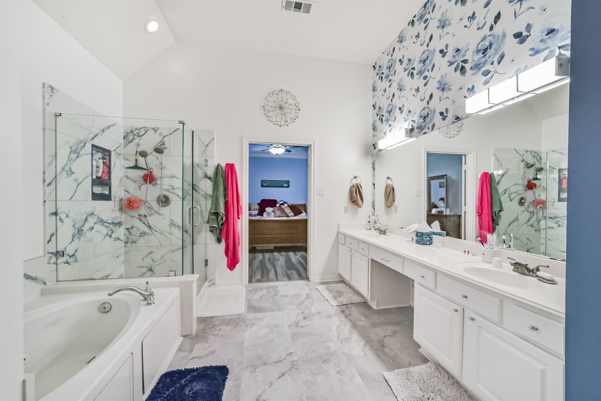 18402 Spinner Court Drive, Humble, TX 77346 The primary bathroom features tiled flooring and a glass-enclosed, tiled shower.