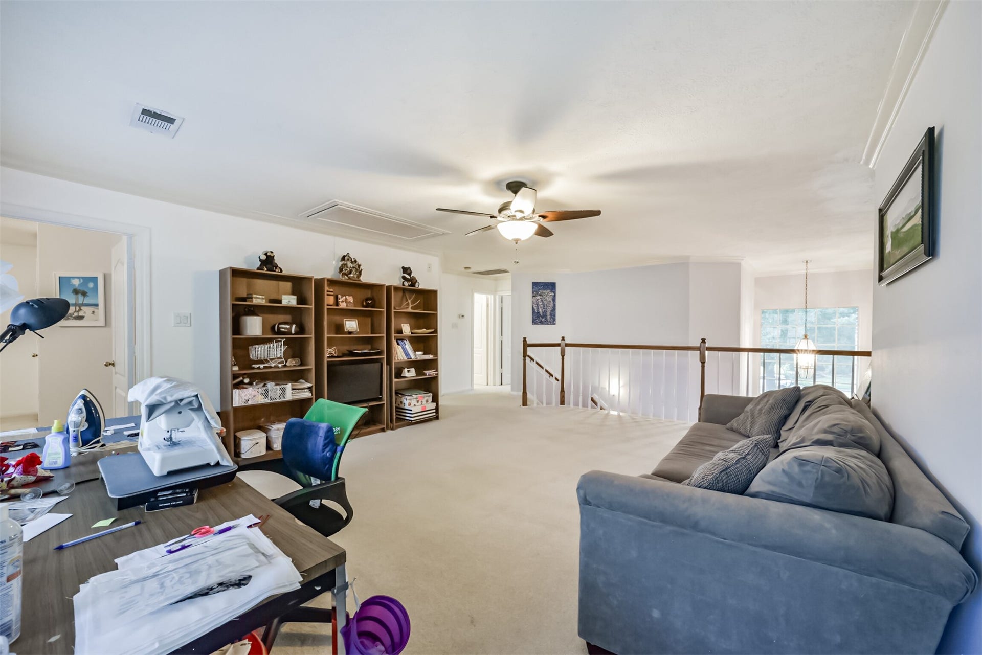 18402 Spinner Court Drive, Humble, TX 77346 The view of the open wood dowels and banister from the game room.