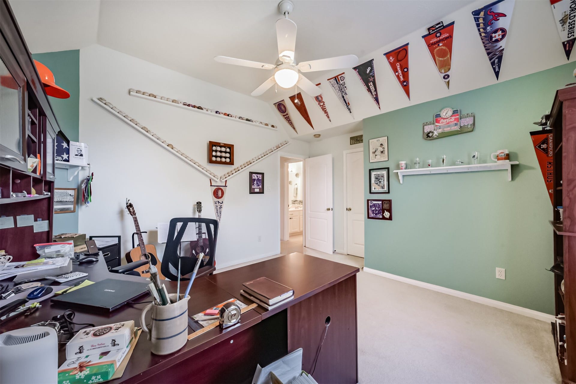 18402 Spinner Court Drive, Humble, TX 77346 Bedroom 4 features a gambrel-style ceiling.