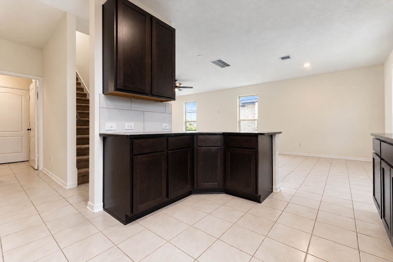 6131 Morning Fern Lane, Humble, TX 77338 The seamless open-concept layout allows for effortless entertaining & easy conversation between the kitchen, dining area, & family room, while abundant cabinetry & generous counter space provide exceptional functionality without sacrificing style.