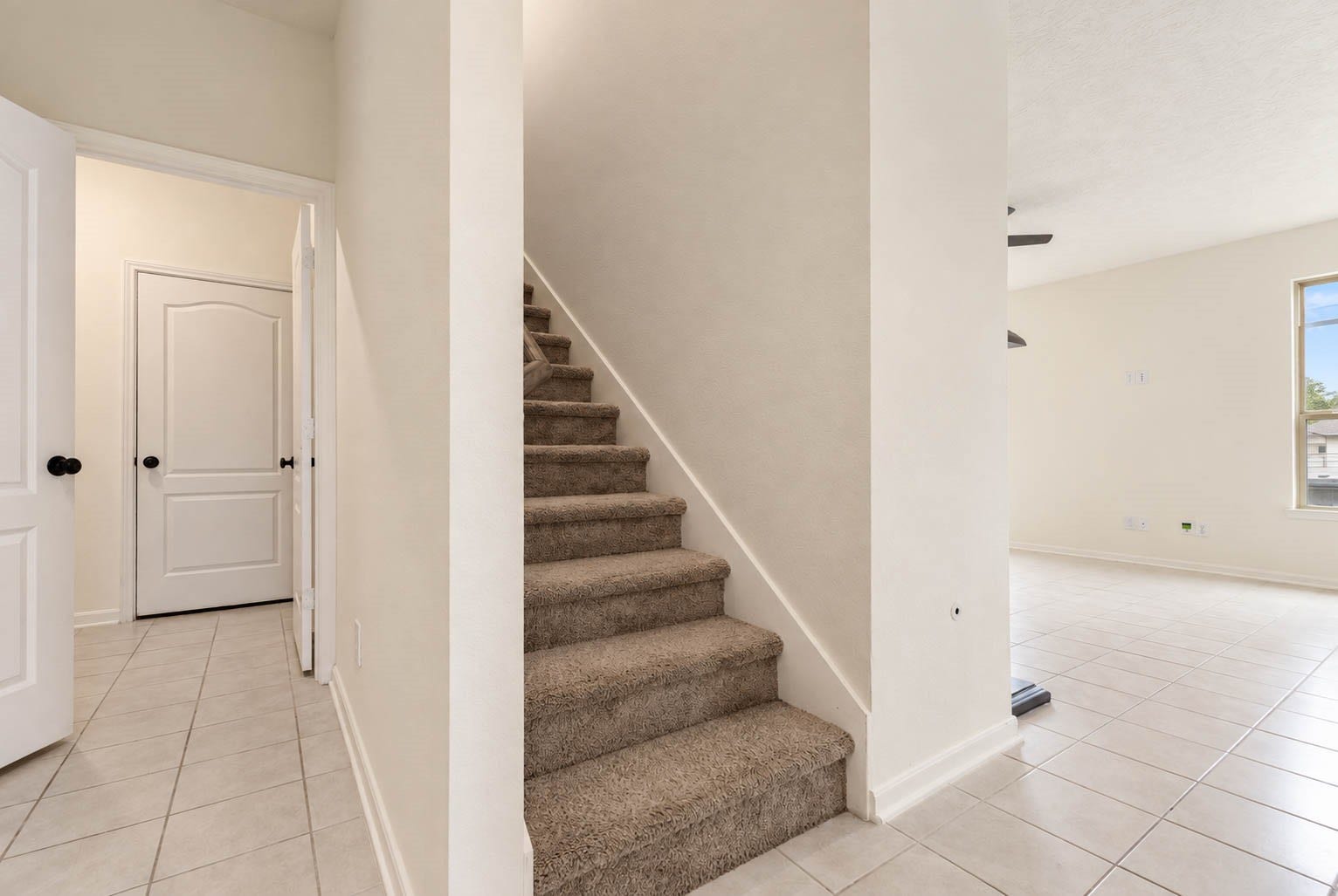 6131 Morning Fern Lane, Humble, TX 77338 A conveniently located staircase leads to the spacious second floor, where a generous game room & comfortable bedrooms offer versatile spaces for entertainment, privacy, & relaxation.