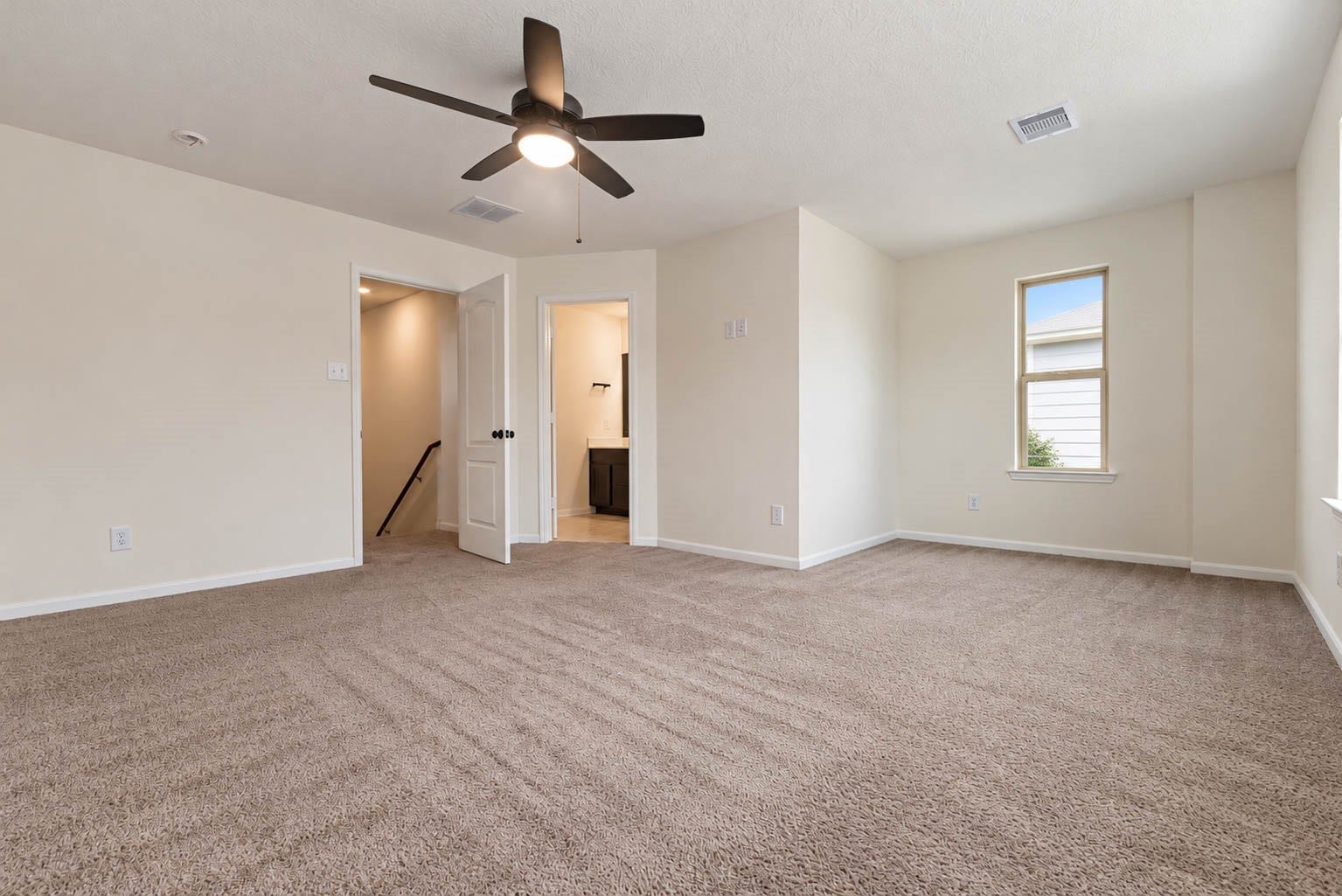 6131 Morning Fern Lane, Humble, TX 77338 Retreat to the expansive second-floor primary suite, a peaceful sanctuary designed for comfort & relaxation.