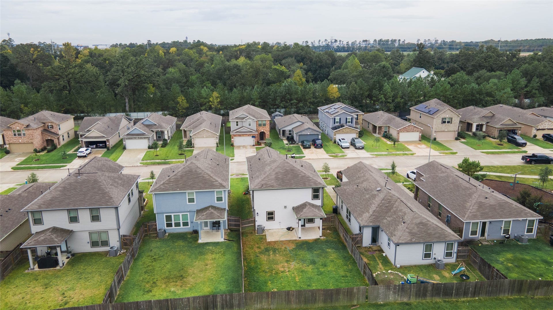6131 Morning Fern Lane, Humble, TX 77338 This beautiful aerial view showcases the home's spacious backyard, covered patio, & desirable location with no immediate rear neighbors!