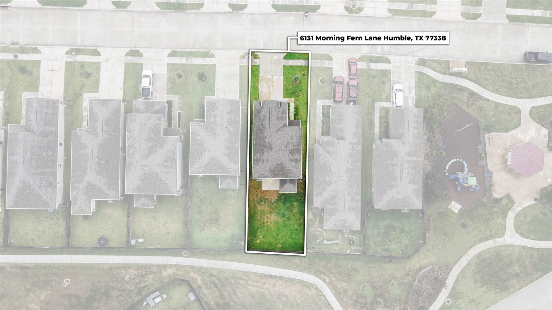 6131 Morning Fern Lane, Humble, TX 77338 A bird's-eye view highlights the home's thoughtfully positioned lot, featuring a spacious driveway, covered back patio, & fully fenced backyard.