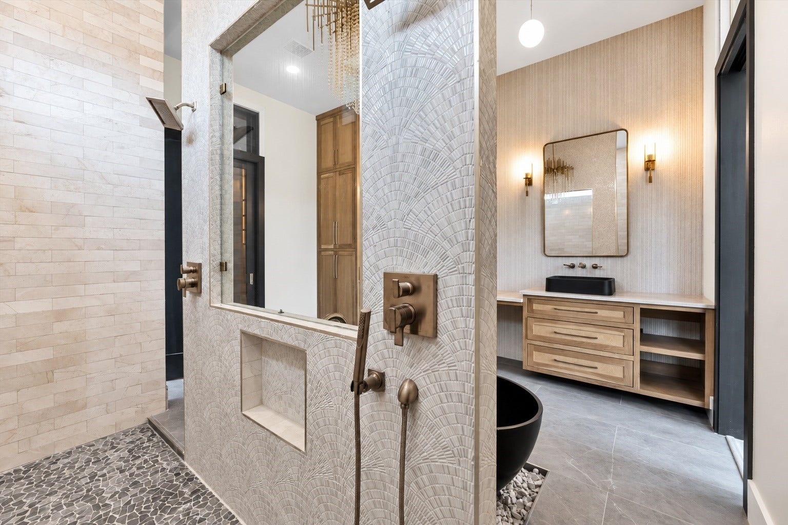 23701 Birch Grove Road, Montgomery, TX 77316 Elevate your daily routine in this luxurious bathroom, featuring exquisite top-of-the-line marble and mosaic ceramic finishes that blend elegance with modern design.