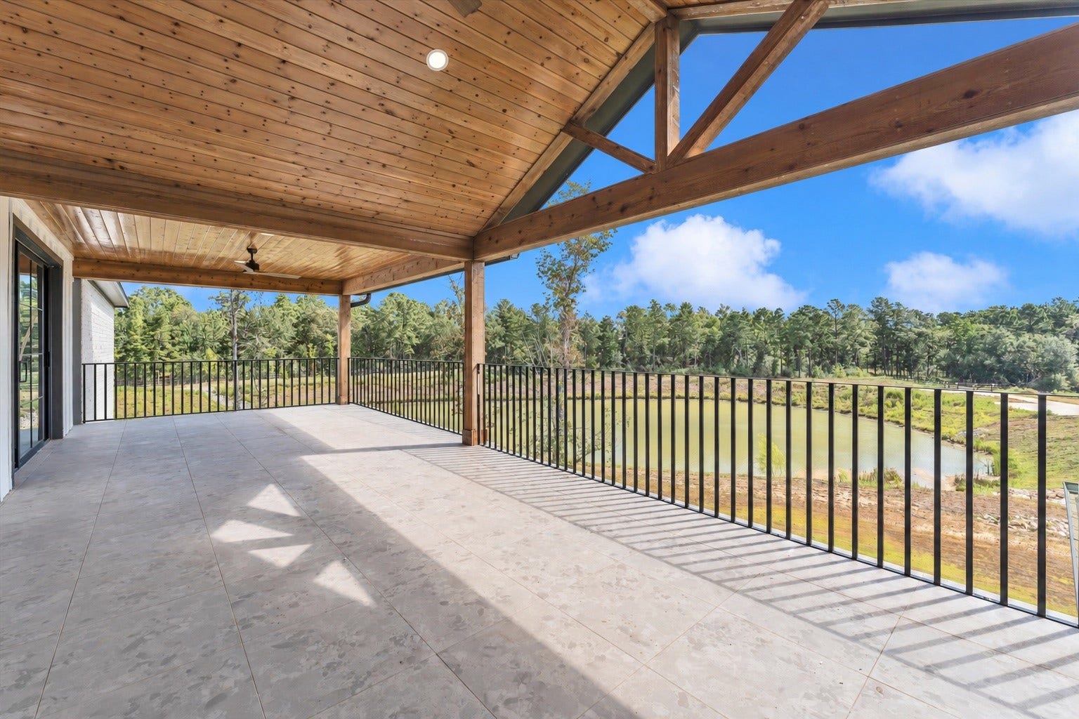23701 Birch Grove Road, Montgomery, TX 77316 Experience breathtaking views from the spacious balcony accessible via both the media room and secondary bedroom.