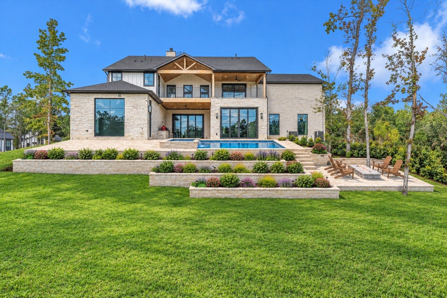 23701 Birch Grove Road, Montgomery, TX 77316 Experience luxury living with this stunning home's resort-style swimming pool, set amidst beautifully landscaped terraces that offer both elegance and tranquility.
