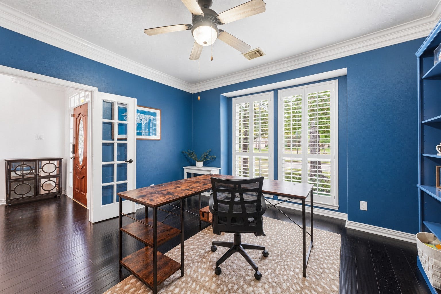 Designated office area to the left as you enter the home.  Gorgeous plantation shutters.