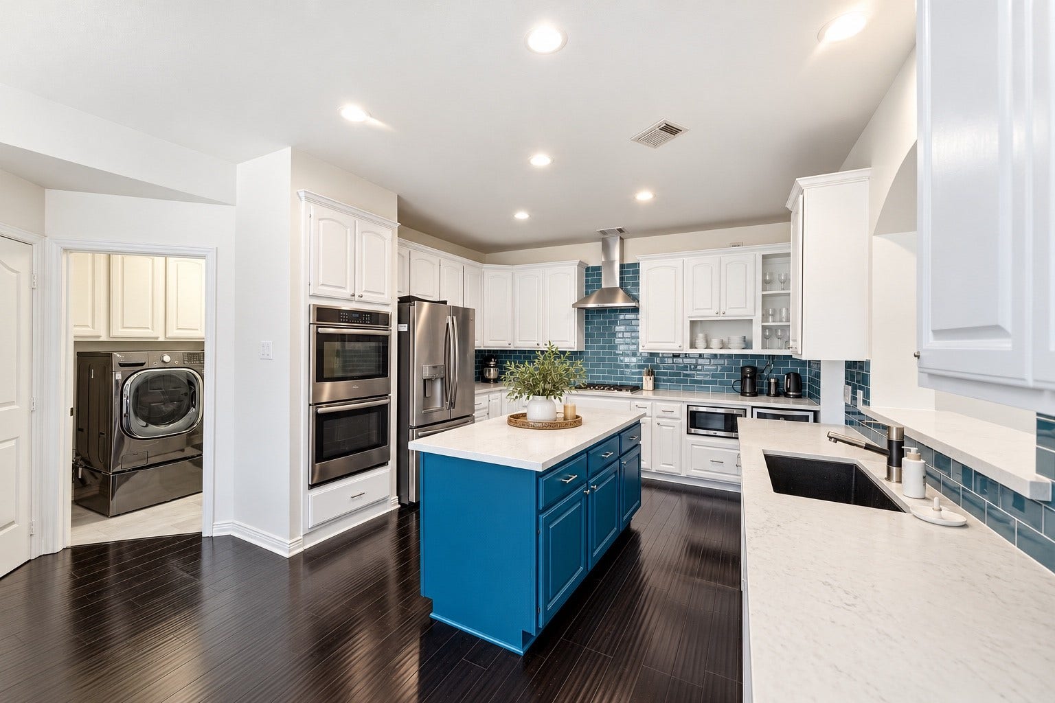 Updated kitchen with double ovens.  Kitchen has been lightly digitally staged.