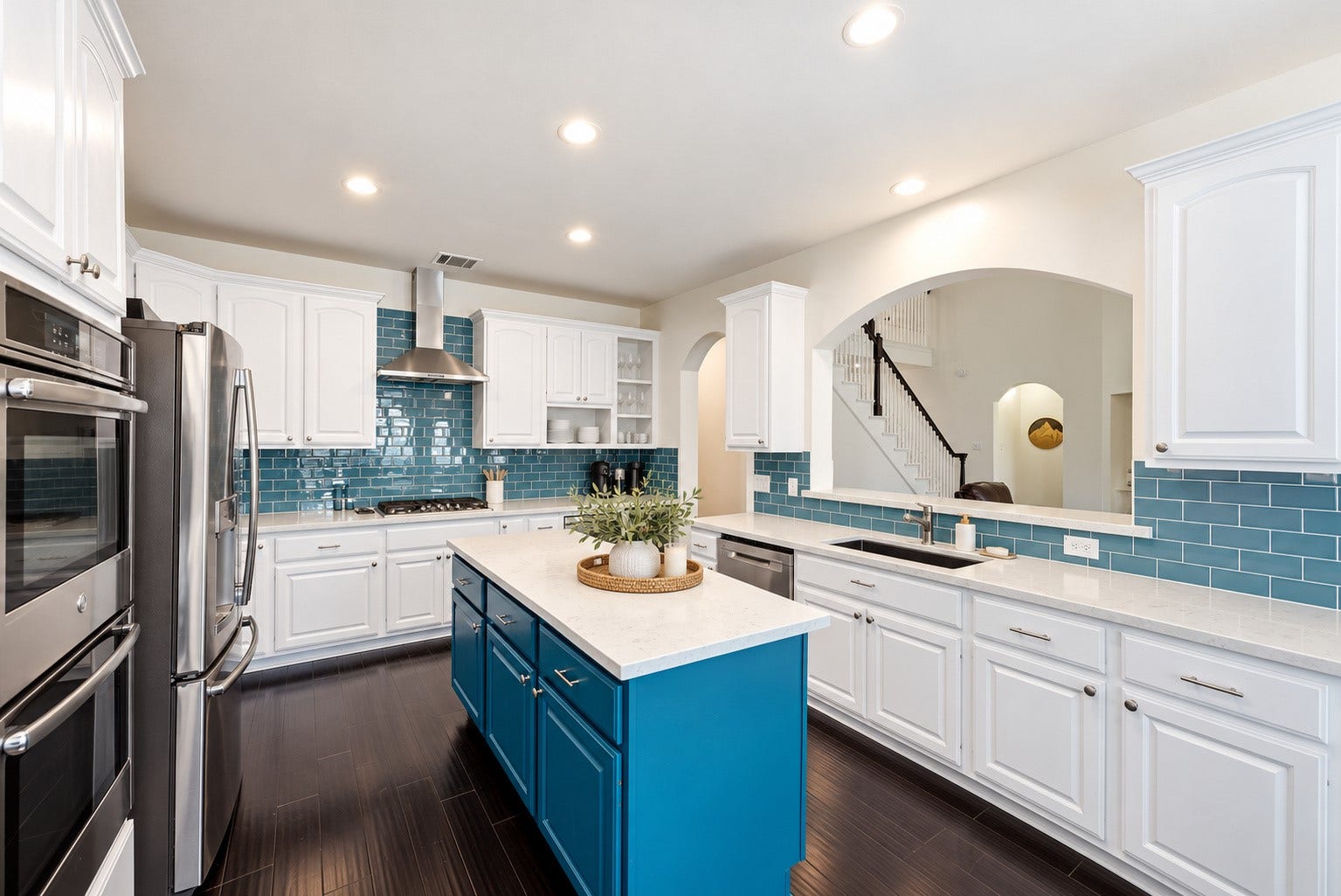 Kitchen open to living space.  All stainless appliances.  Kitchen has been lightly digitally staged.