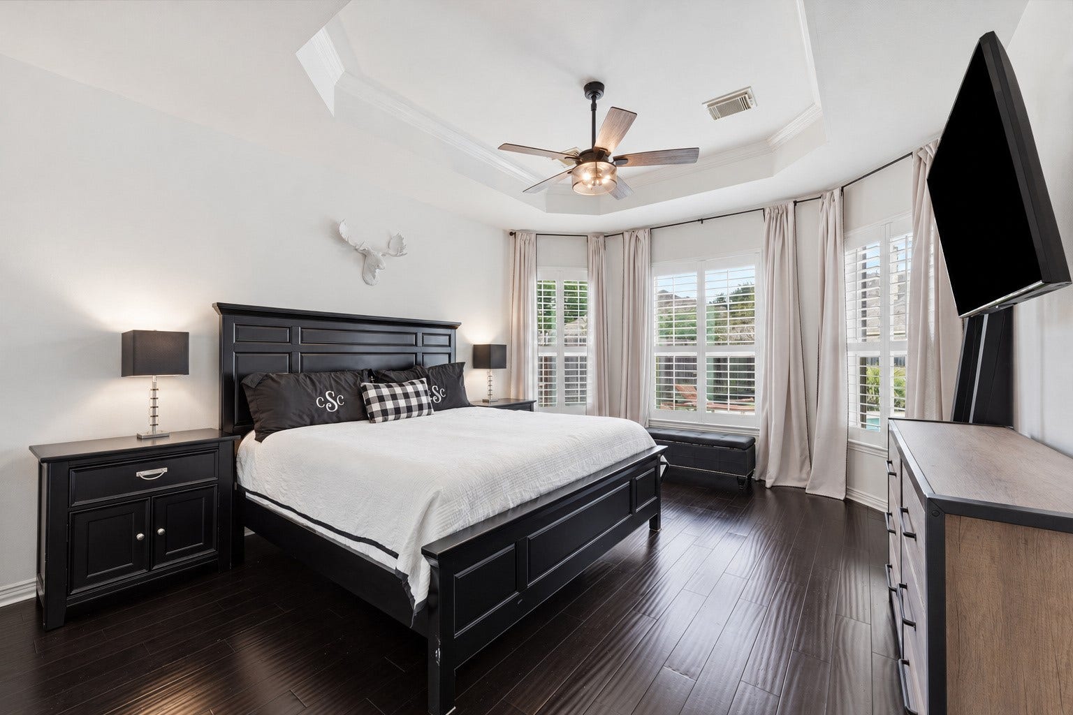 Primary bedroom downstairs with views of the pool