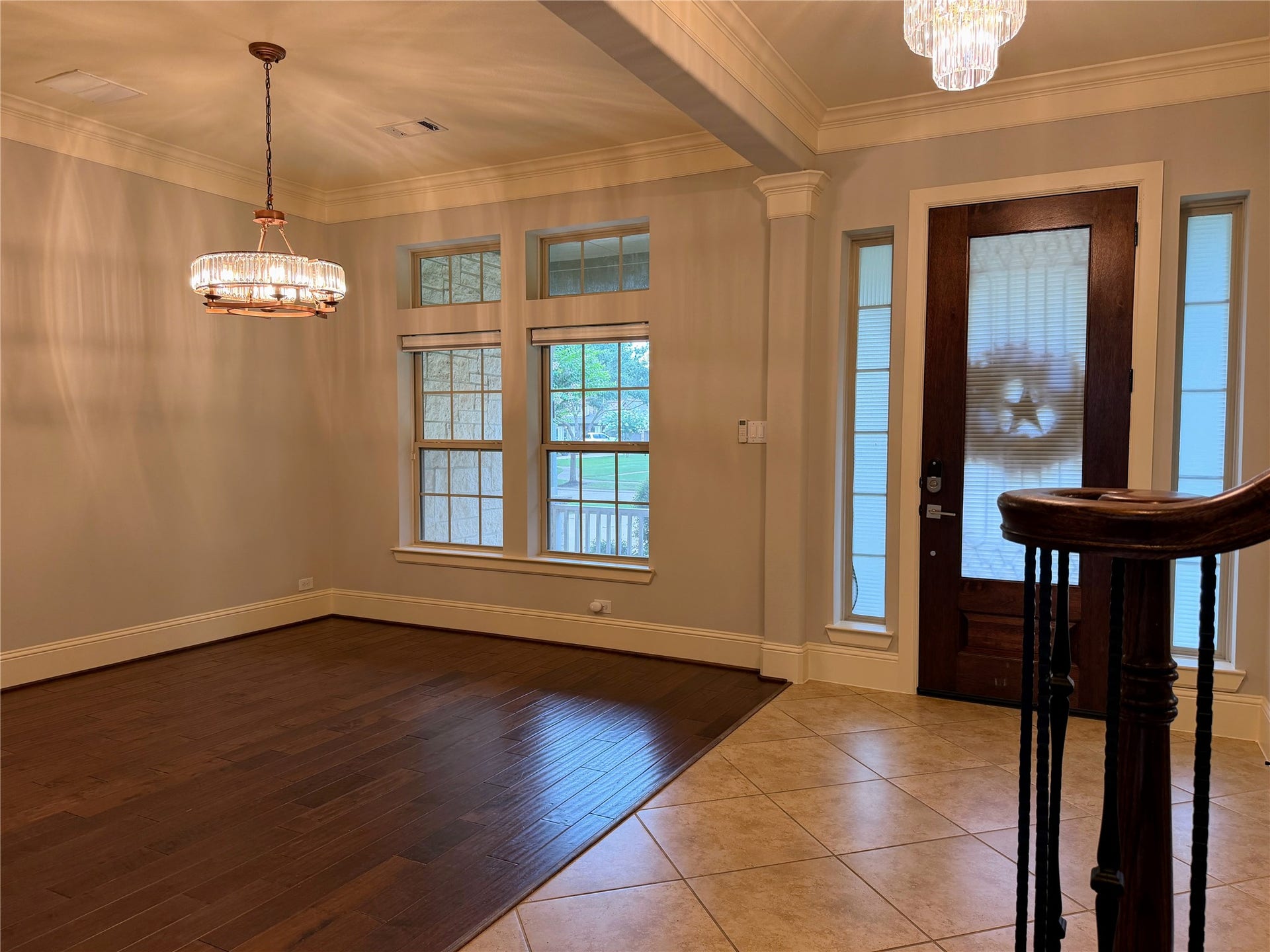 5119 Water Oak Crescent, Fulshear, TX 77441 Sophisticated formal dining room! Features gorgeous, deep-toned hardwood floors, crisp crown molding, and a stunning contemporary chandelier. Large windows flood the space with natural light, making it perfect for hosting memorable dinners.