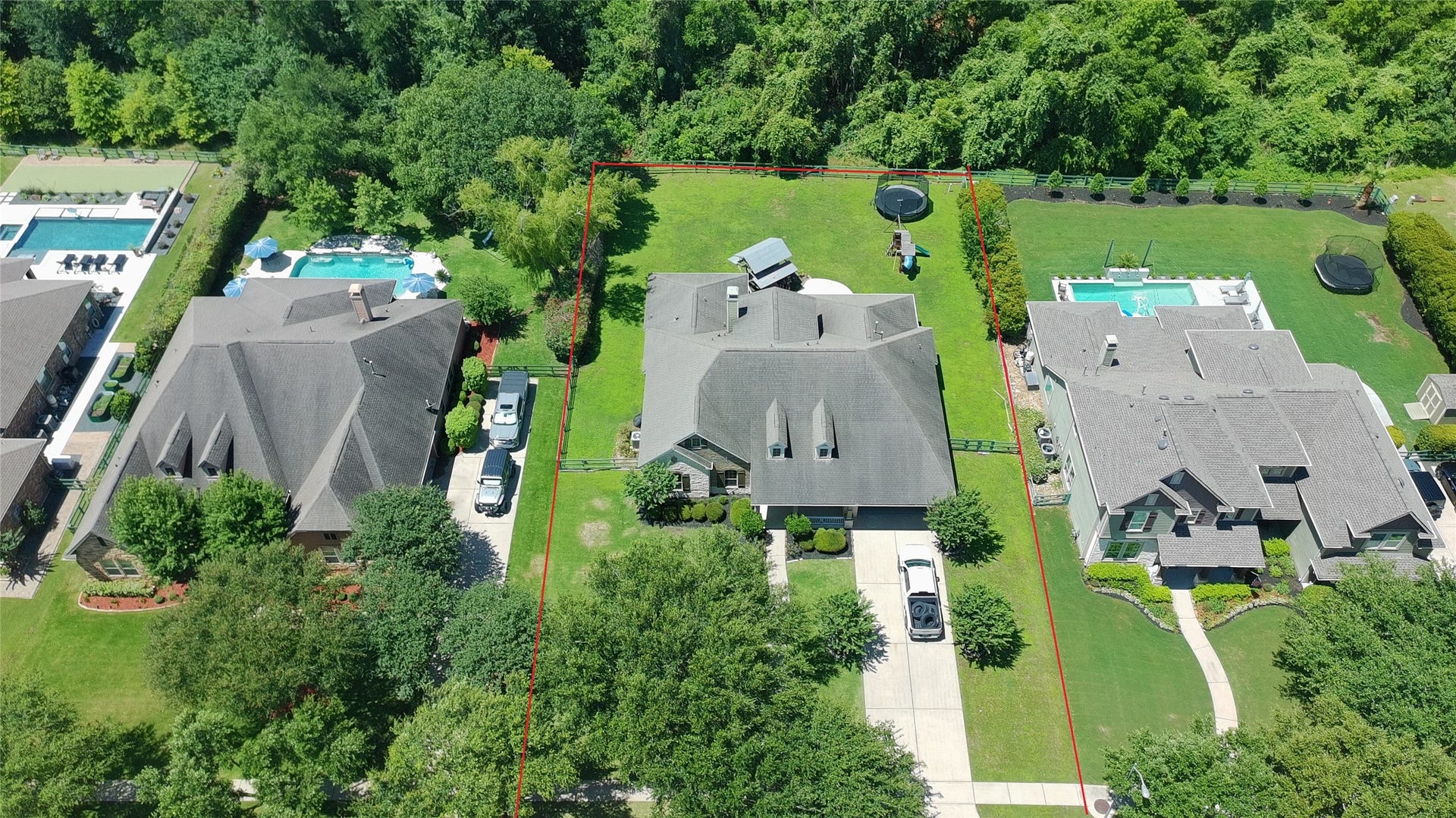 5119 Water Oak Crescent, Fulshear, TX 77441 Stunning aerial view highlighting the premium corner cul-de-sac lot! Showcases the expansive property, beautiful perimeter trees, sprawling lawn, and the homes impressive architectural footprint.