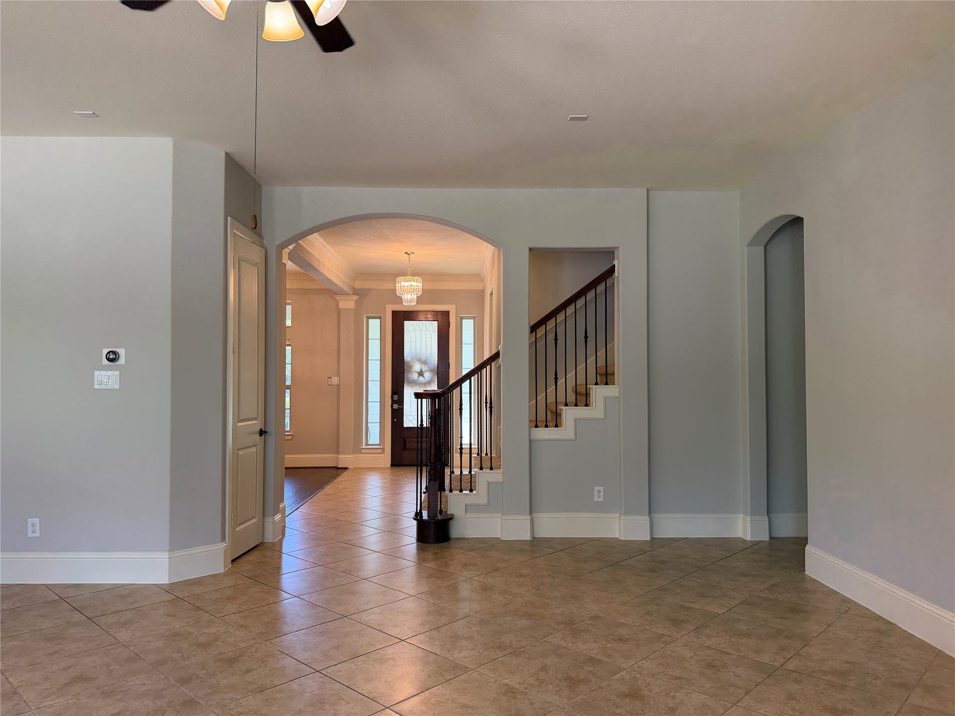 5119 Water Oak Crescent, Fulshear, TX 77441 Expansive open-concept living! This bright, airy space boasts low-maintenance tile flooring, a spacious breakfast bar overlooking the kitchen, and seamless sightlines to the grand entryway, staircase, and formal living areas.