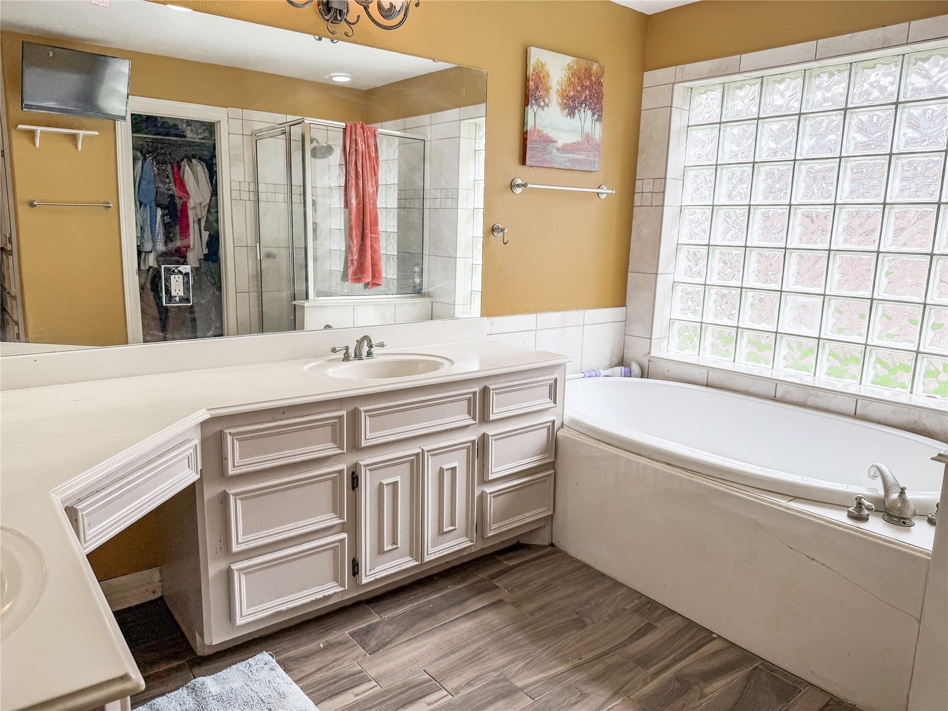 134 Dove Trail, Richwood, TX 77531 Primary bathroom offering plenty of built-in storage, generous counter space, and a functional layout for everyday convenience.