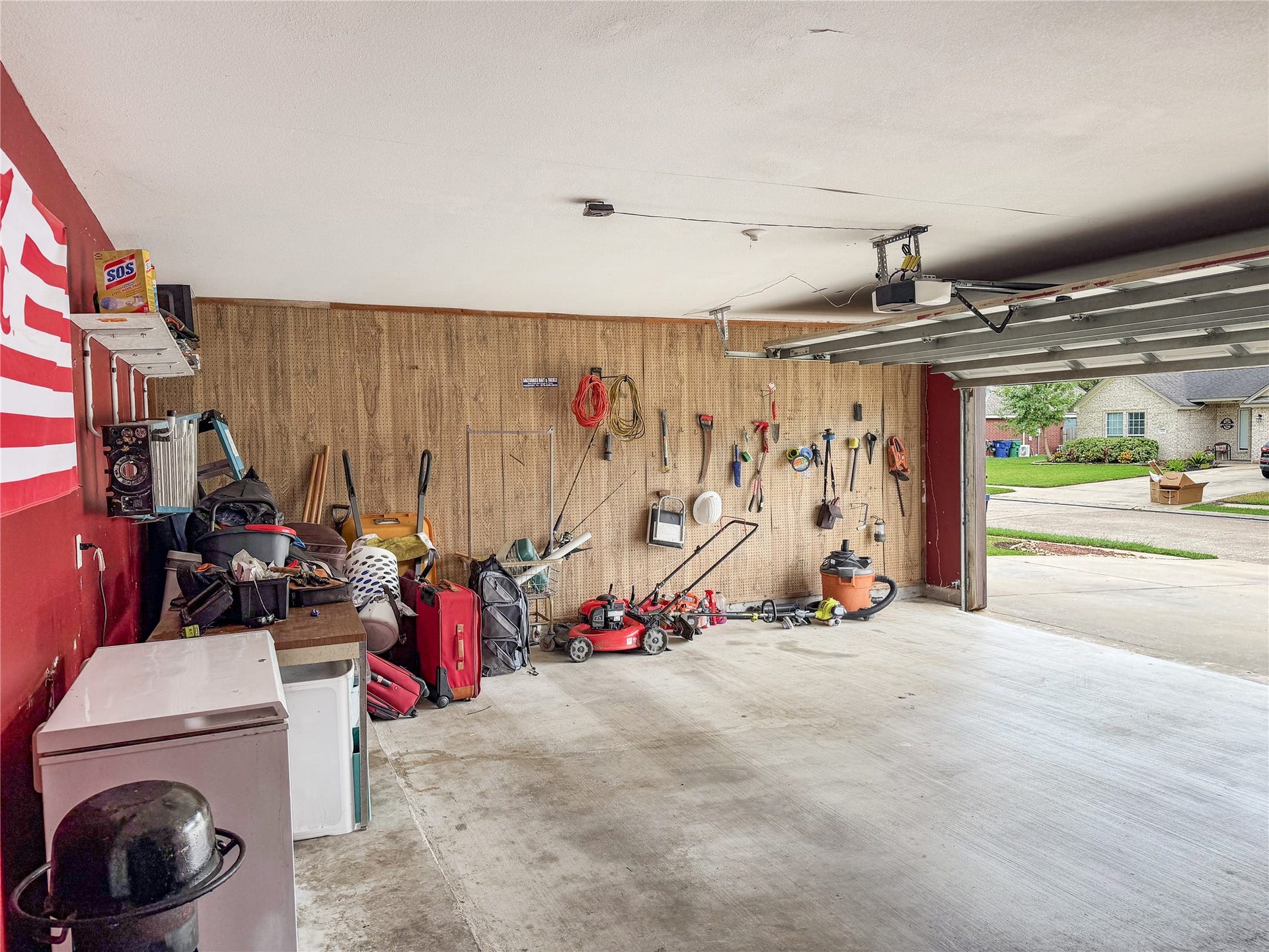 134 Dove Trail, Richwood, TX 77531 Roomy two-car garage offering ample space for parking, storage, and additional everyday needs.