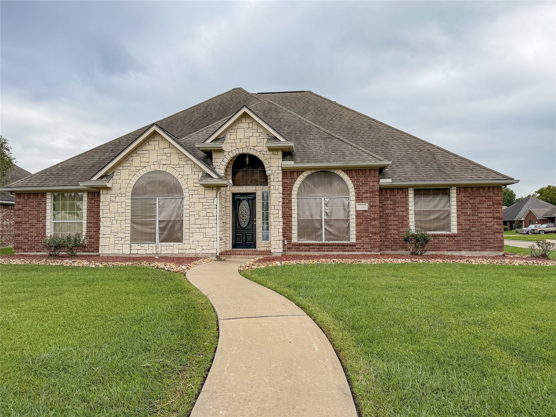 134 Dove Trail, Richwood, TX 77531 Inviting front exterior showcasing the homes curb appeal, established landscaping, and welcoming entry.
