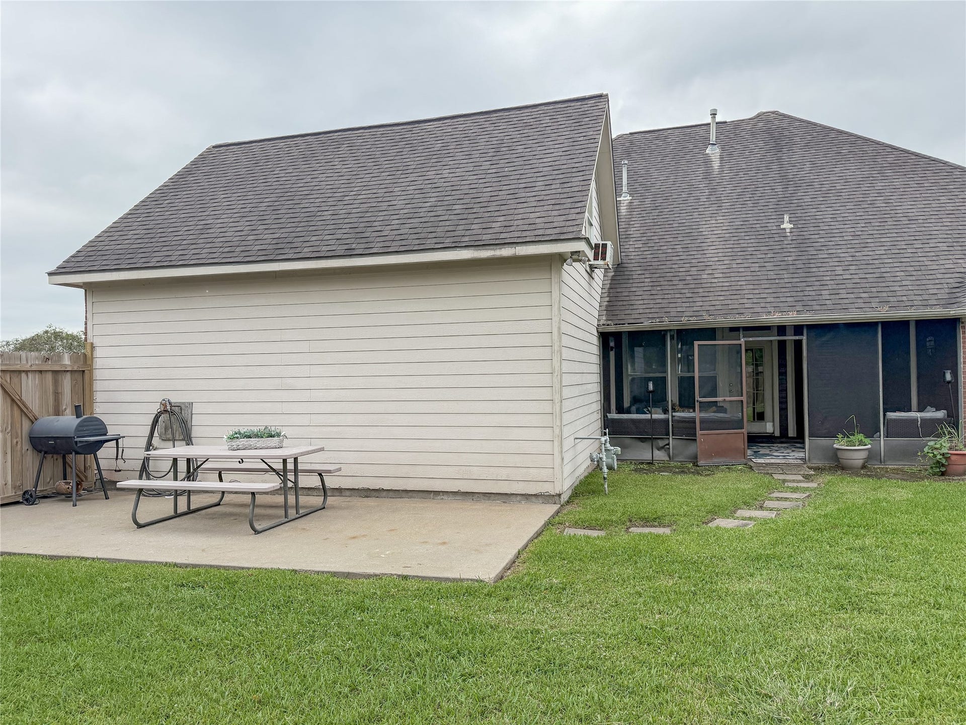 134 Dove Trail, Richwood, TX 77531 Concrete patio area in the backyard provides a versatile space for outdoor seating, dining, grilling, or entertaining.