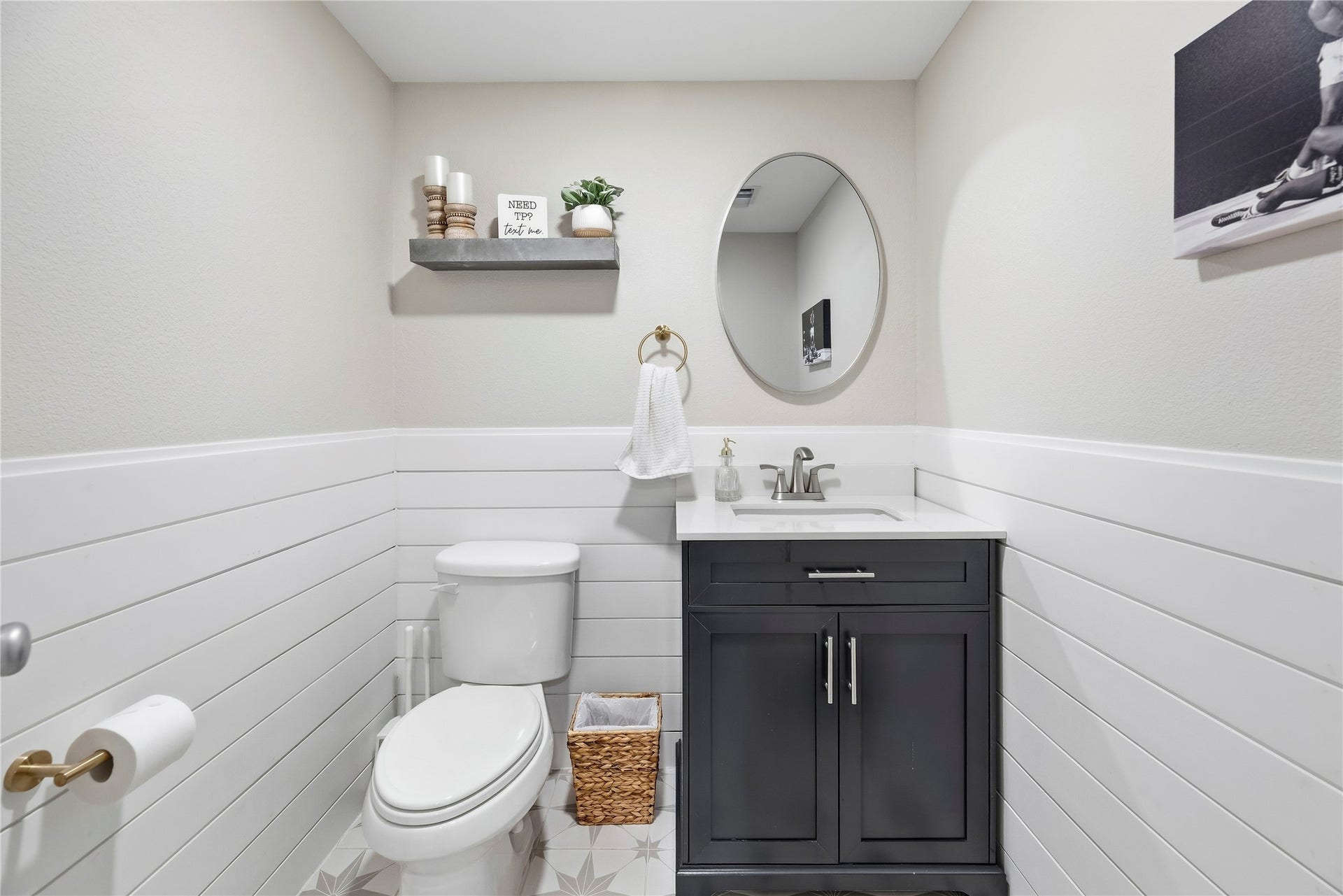 26819 Rockwood Park Lane, Cypress, TX 77433 Half bathroom with a shiplap wall and stunning tile flooring. Easy access to the backyard.
