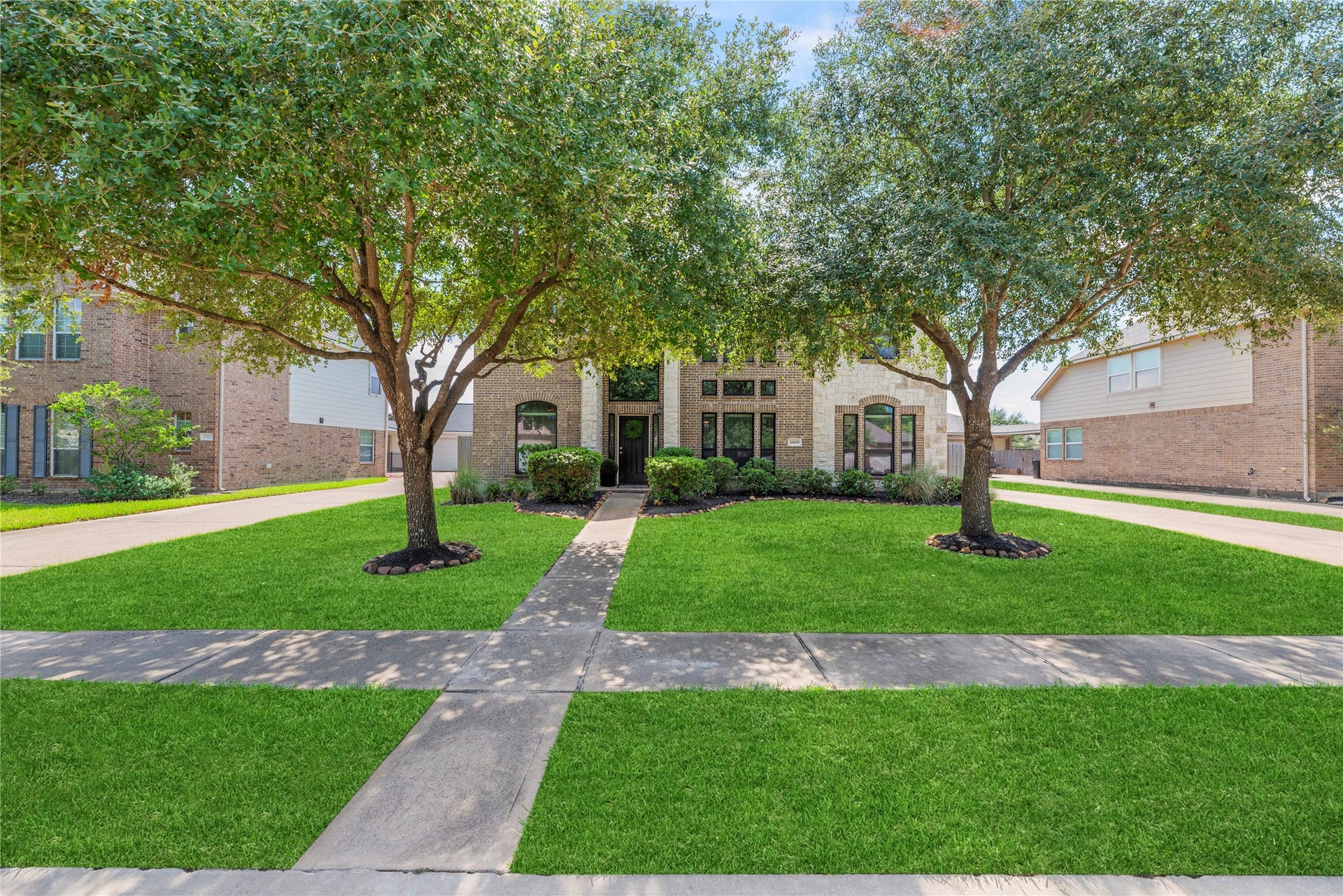 26819 Rockwood Park Lane, Cypress, TX 77433 Lush landscaping and mature trees create lovely curb appeal.