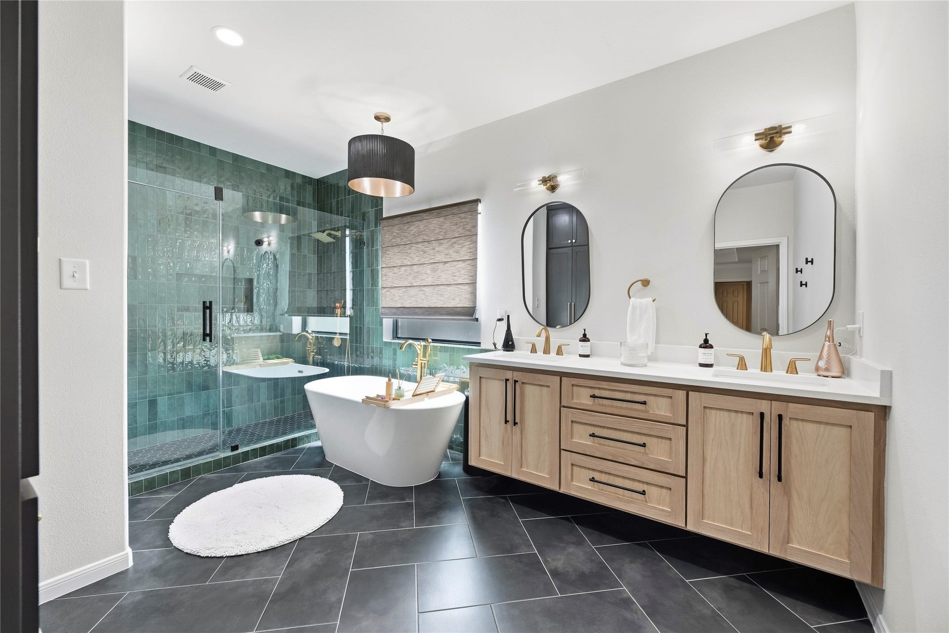 26819 Rockwood Park Lane, Cypress, TX 77433 Beautifully remodeled primary bathroom features a dual sink floating vanity, stand-alone tub and oversized shower.