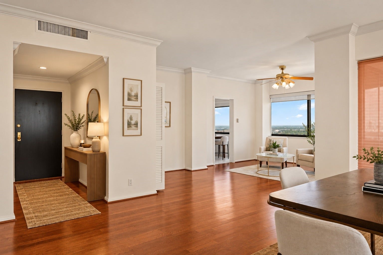 **Virtually Staged Entry** The gracious entry introduces the penthouse's light neutral palette and substantial scale. Clear sightlines lead naturally toward the living spaces and panoramic windows beyond.