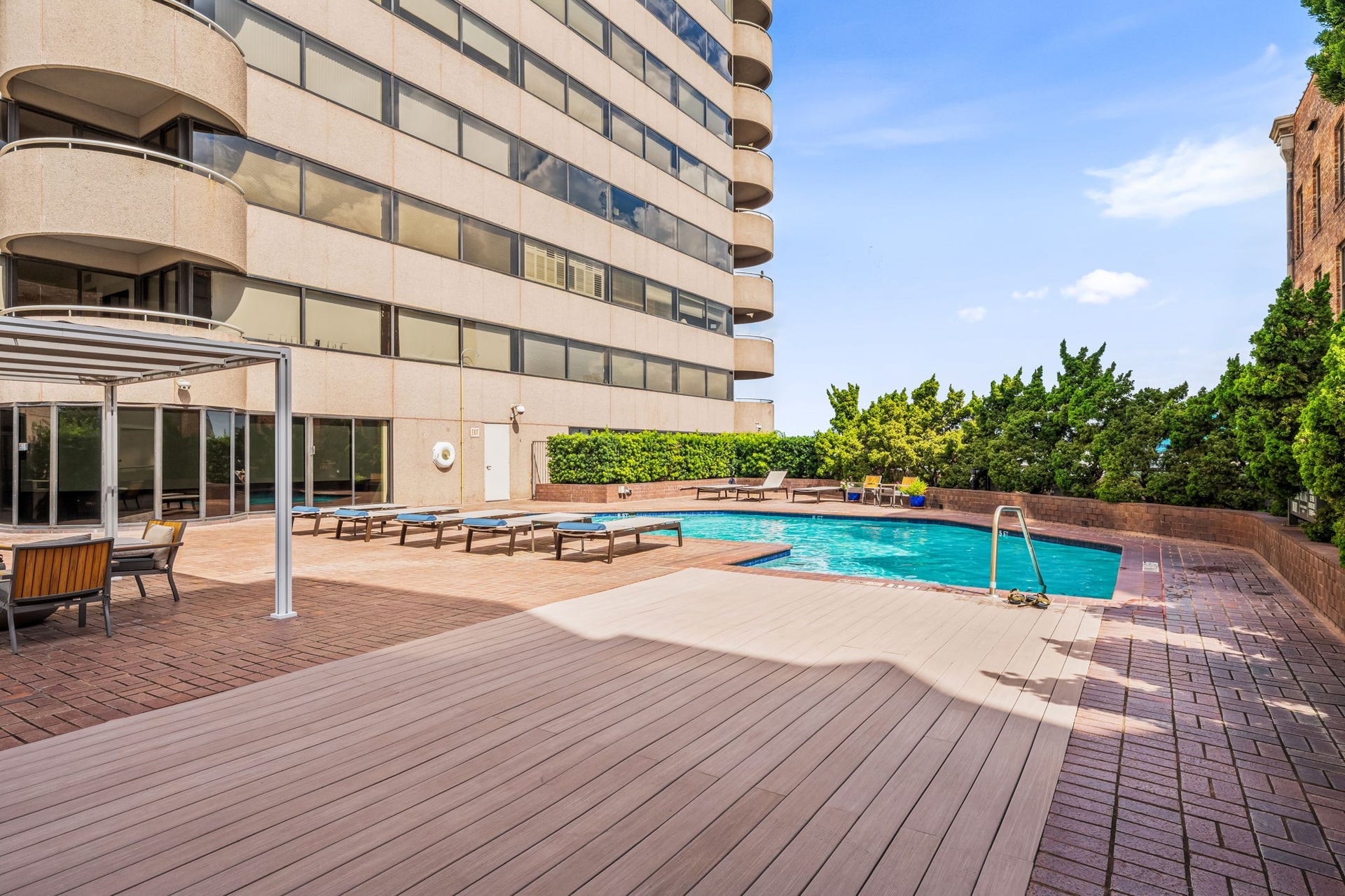 The sixth-floor pool deck offers a resort-inspired setting surrounded by landscaped grounds. Residents can enjoy convenient recreation and relaxation without leaving the building.