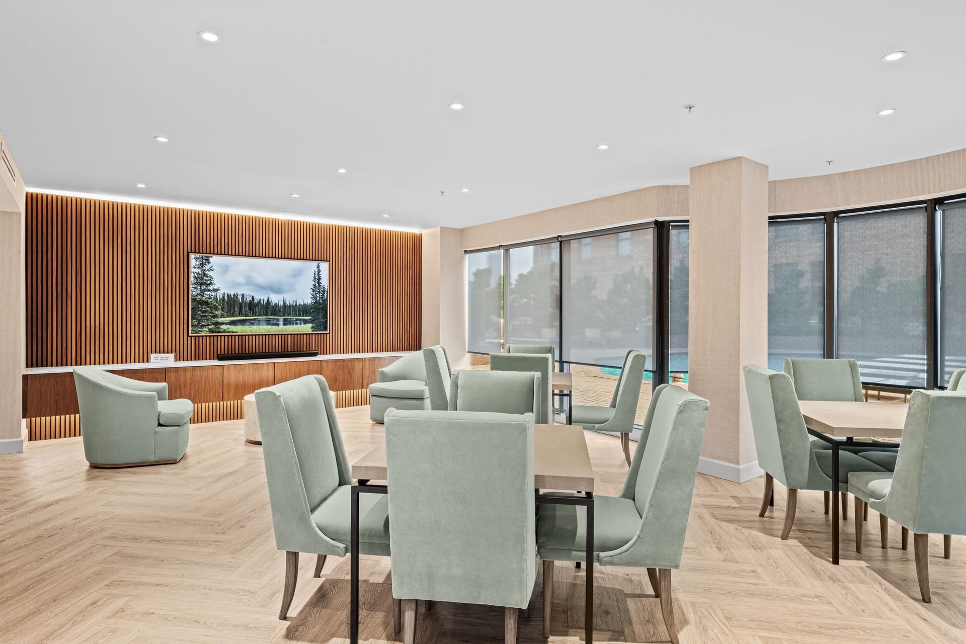 A spacious residents entertaining salon is available for entertaining beyond the private residence. Large windows and direct access to the outdoor amenities keep the setting bright and welcoming.