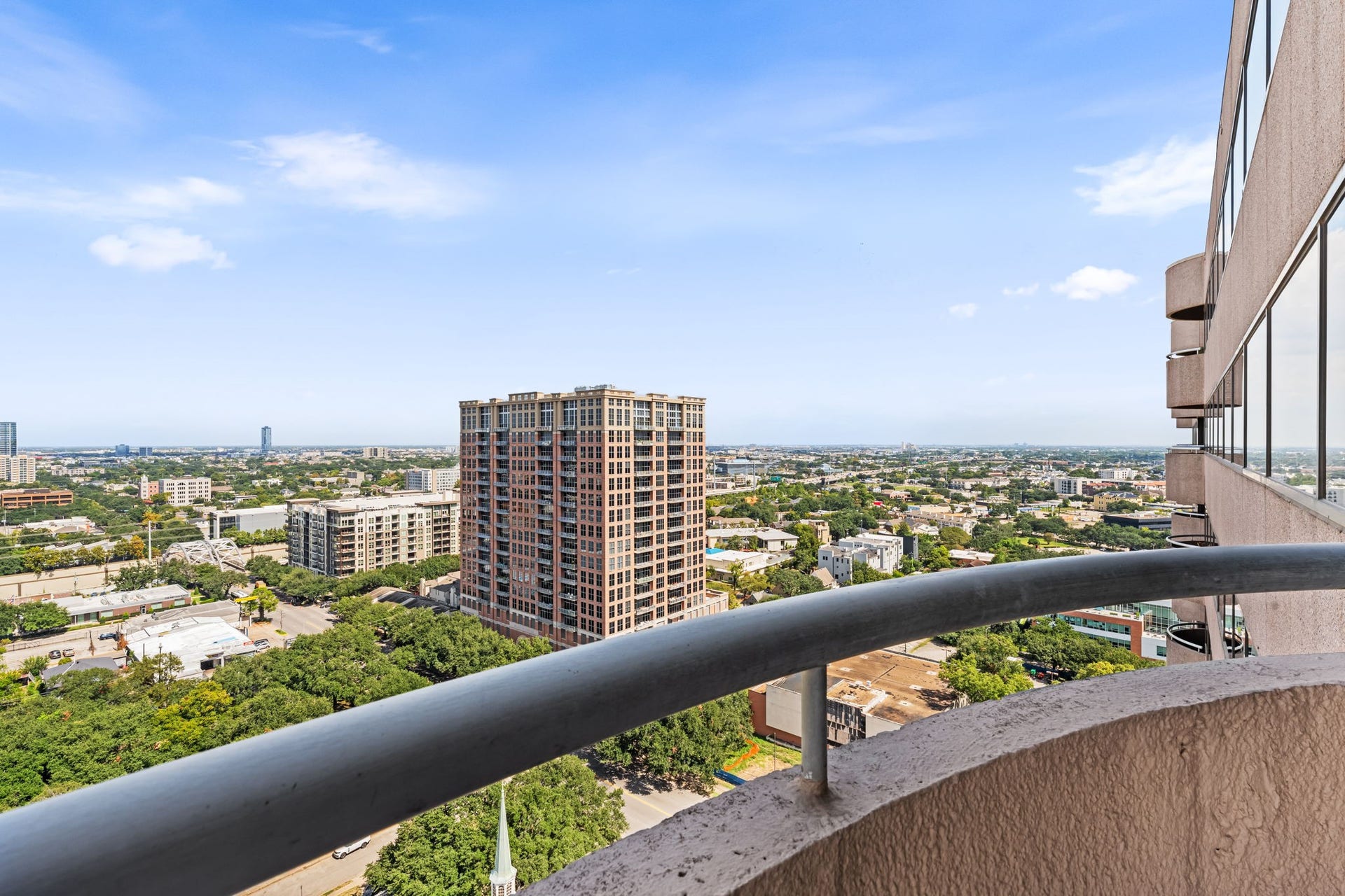 The second balcony offers another unobstructed perspective over the surrounding neighborhoods and skyline. Its private setting creates a memorable backdrop for quiet mornings or evening sunsets.