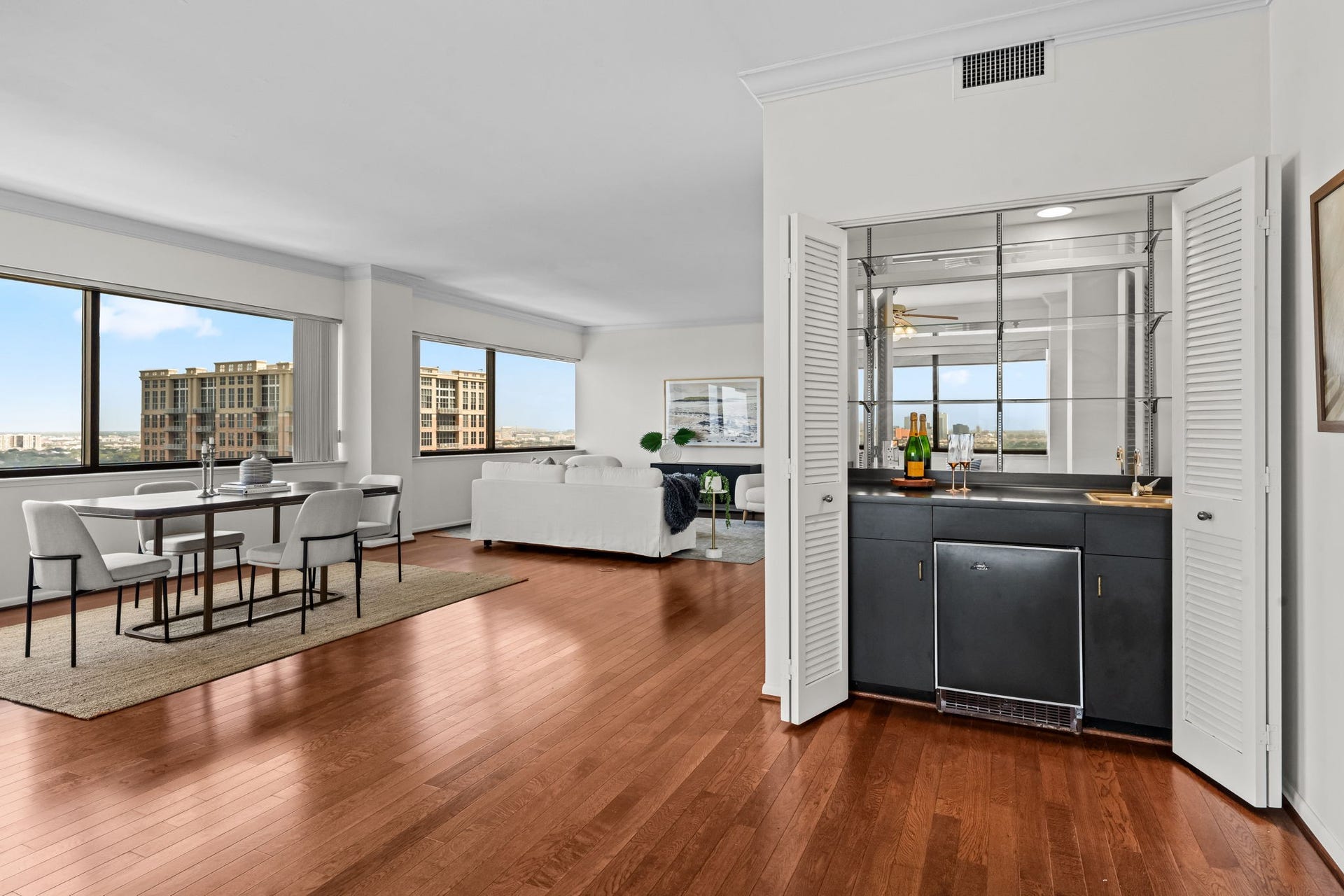 Well-appointed wet bar enhances the home's entertaining potential while maintaining an open connection to the dining room.