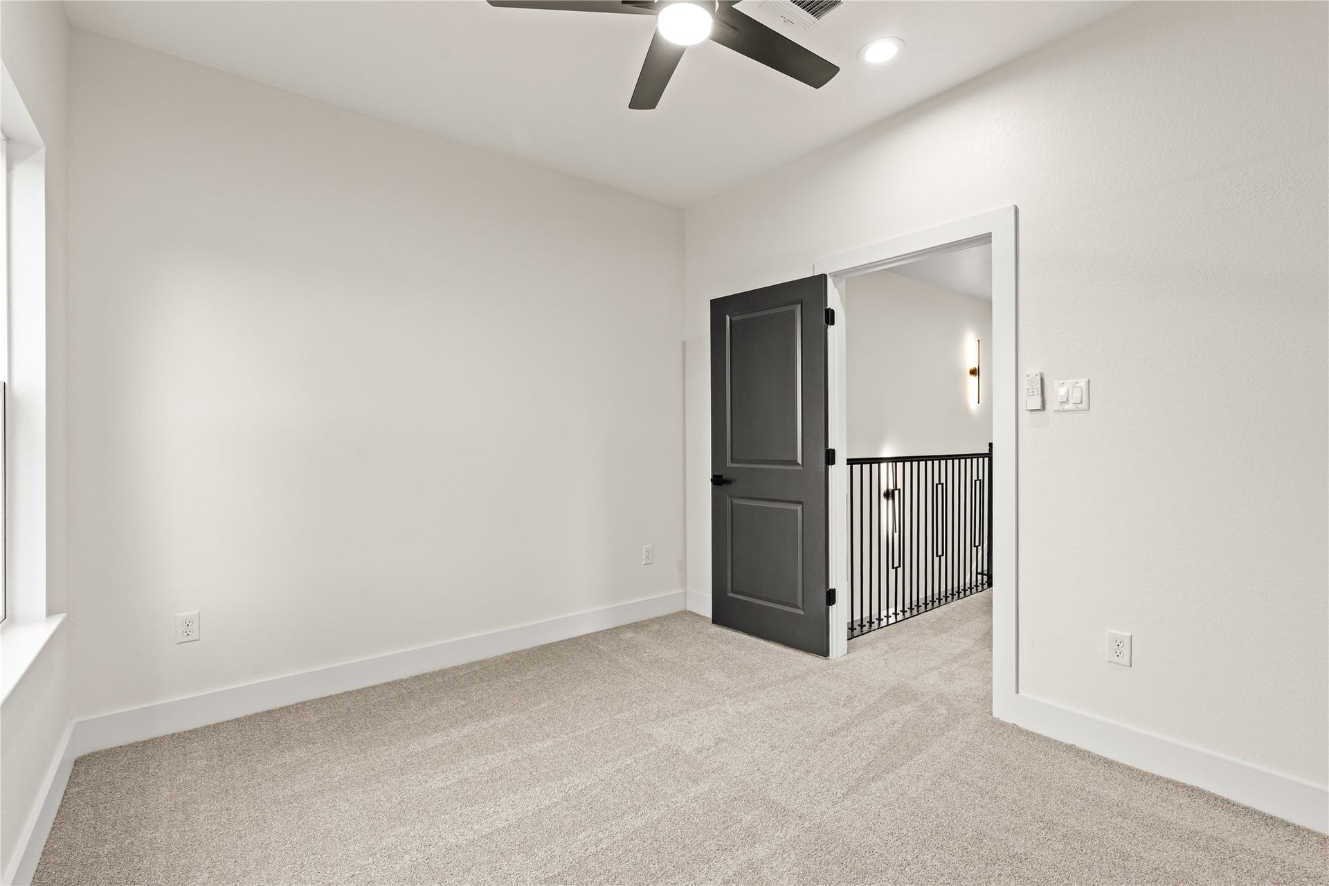 4521 Newberry Street, Houston, TX 77051 Upper-level bedroom perspective smooth interior door access leading directly out to the wrought-iron stair landing.
