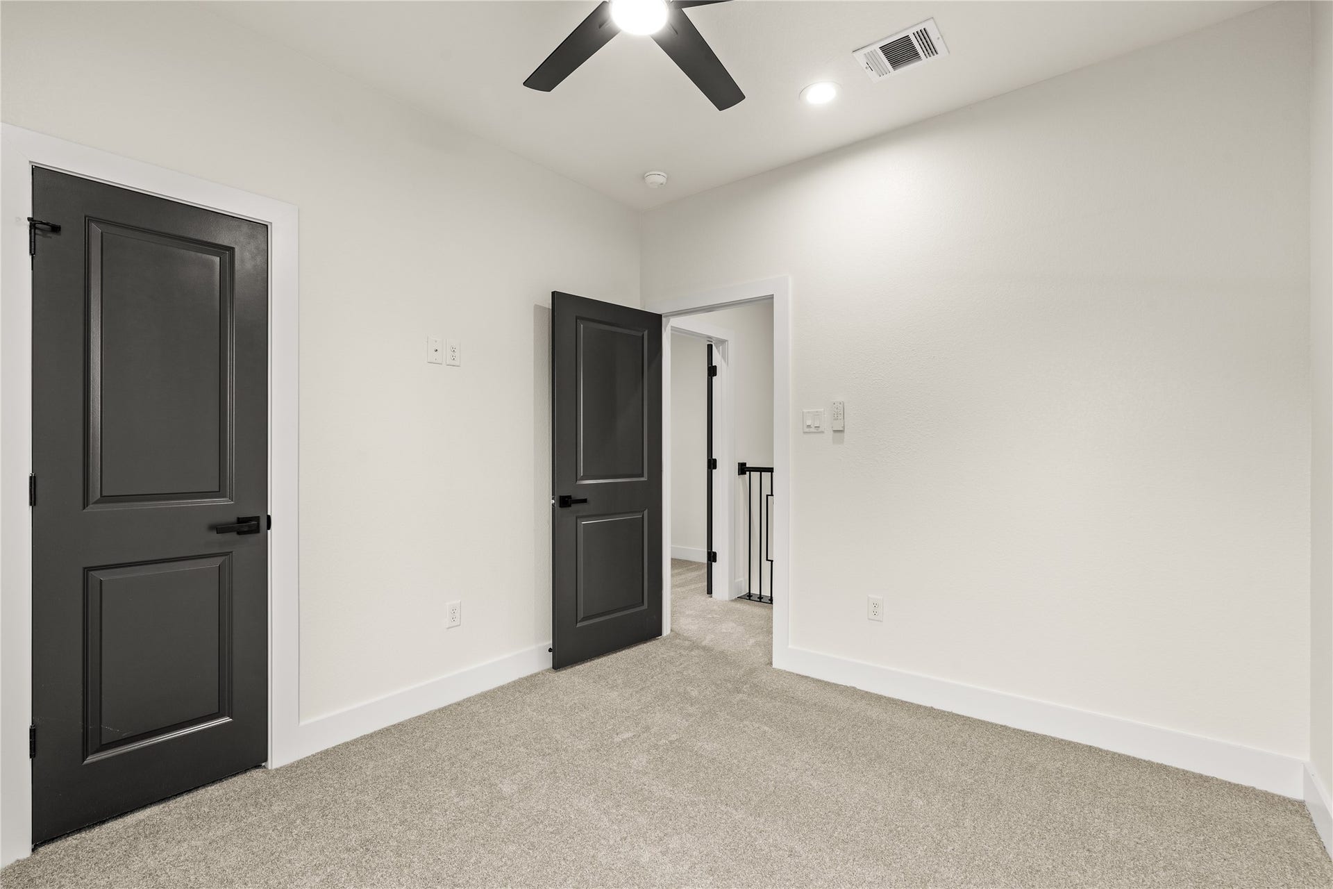 4521 Newberry Street, Houston, TX 77051 Spacious bedroom layout high baseboards, pre-wired media connections, and clean contrast trim detailing.