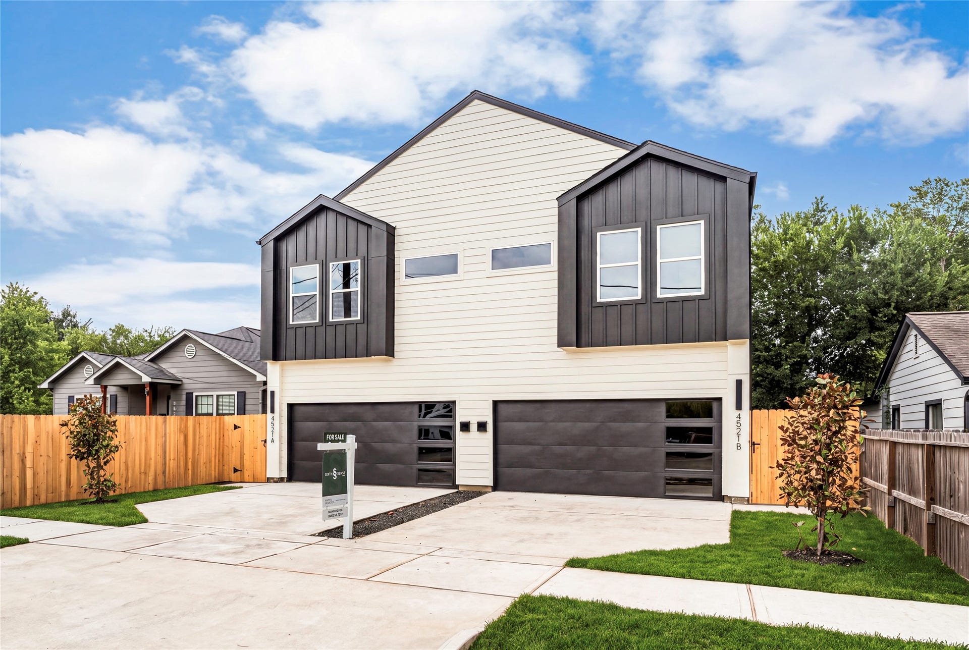 4521 Newberry Street, Houston, TX 77051 Sleek modern profile dark horizontal accents, glass-inset garage detailing, and perimeter privacy fencing around the property.
