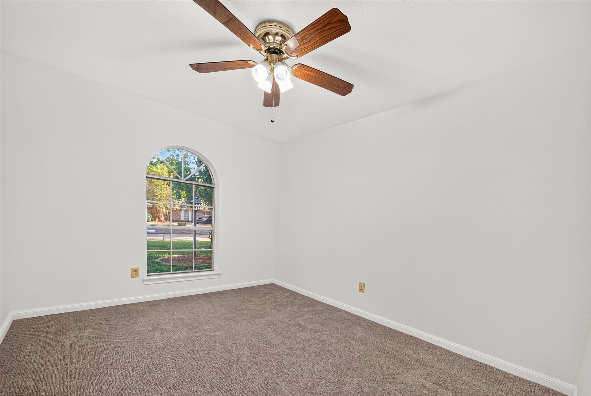 7602 Salge Drive, Houston, TX 77040 Plush new carpet, fresh paint and a beautiful arched window adds architectural charm while filling the room with natural light and offering a lovely view of the tree-lined front yard.