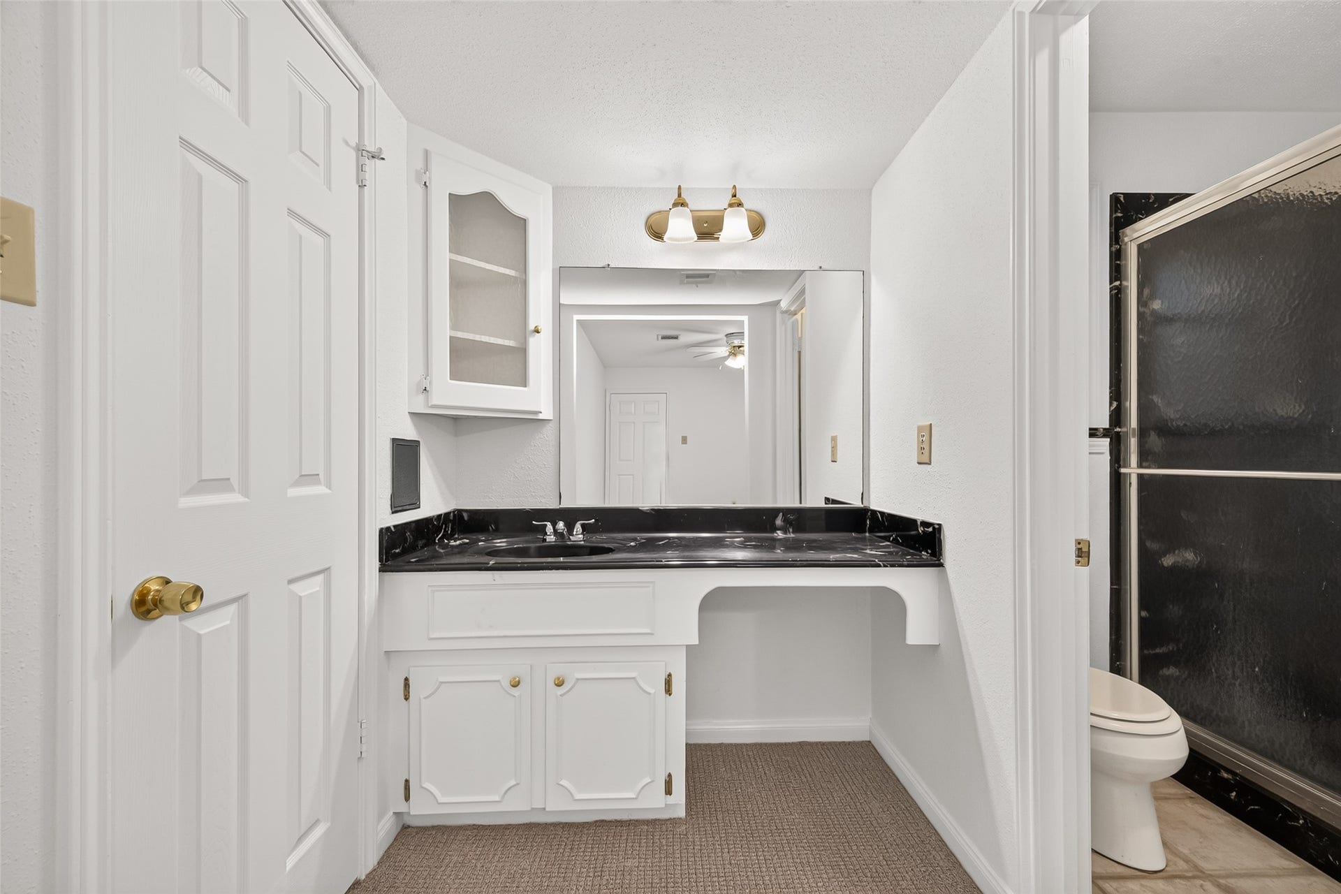 7602 Salge Drive, Houston, TX 77040 A dedicated space for your morning routine, conveniently located just outside the private bathroom with an enclosed shower.