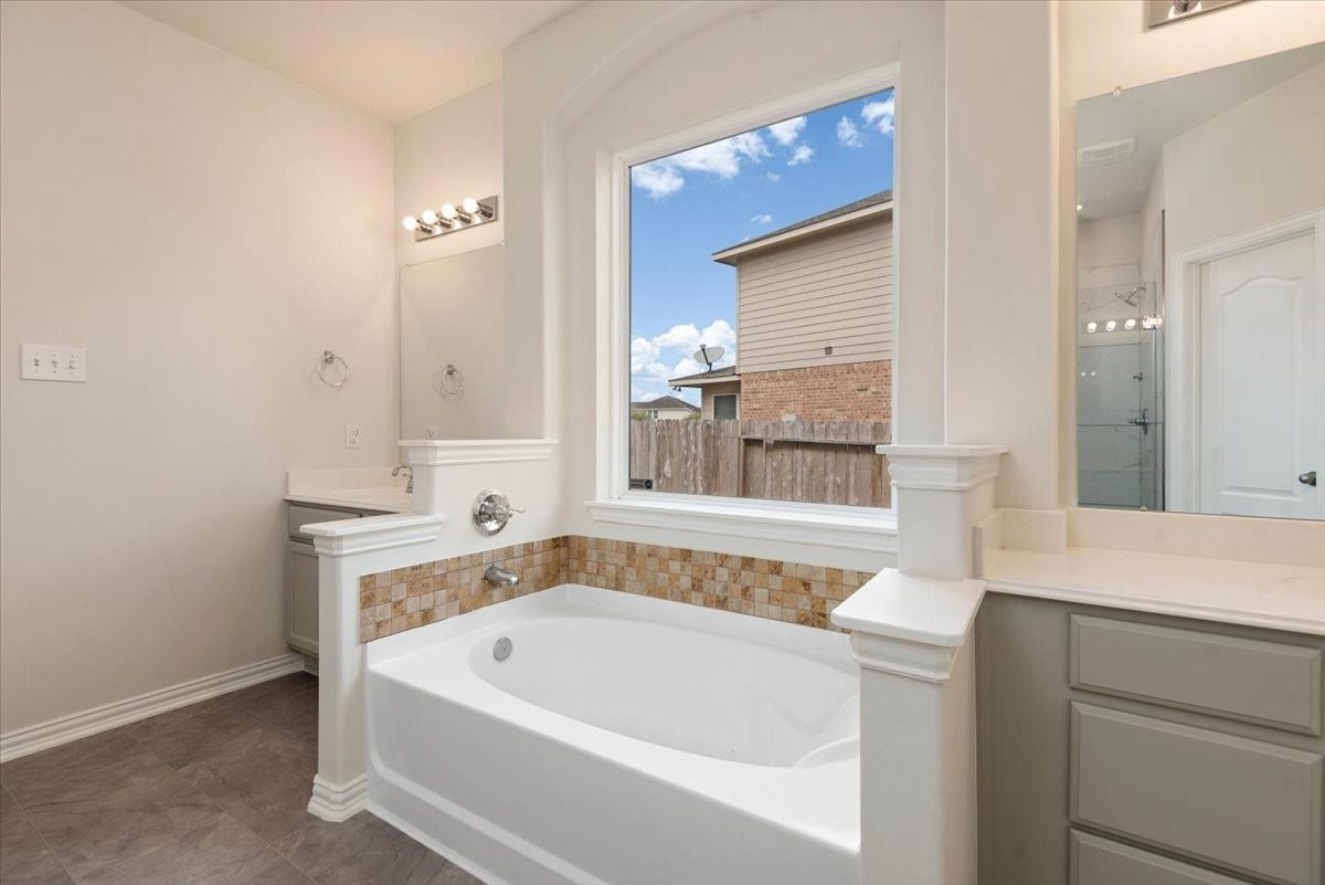 16123 Laura Beth Drive, Hockley, TX 77447 Soaking tub in primary bathroom.