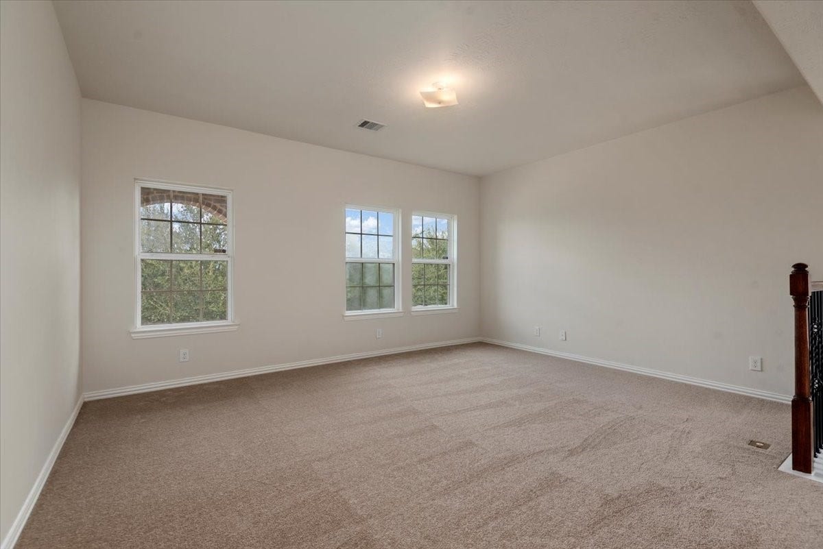 16123 Laura Beth Drive, Hockley, TX 77447 2nd floor gameroom w/new carpet and paint. This room will hold a pool table and more.