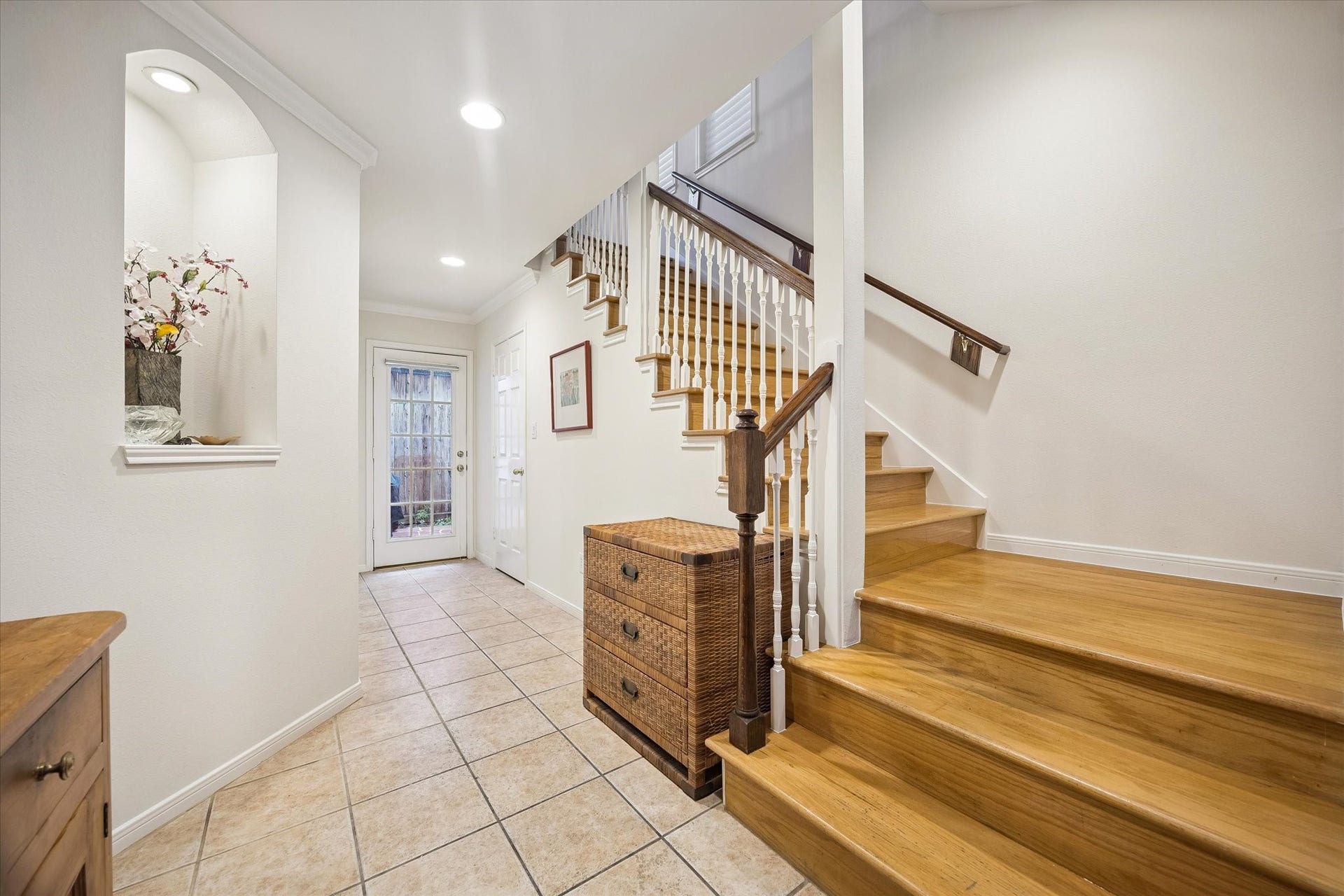 5213 Blossom Street, #A, Houston, TX 77007 Welcoming foyer w/ one of the art niches on left. Large walk-in closet is nicely hidden under the stairs on the right.