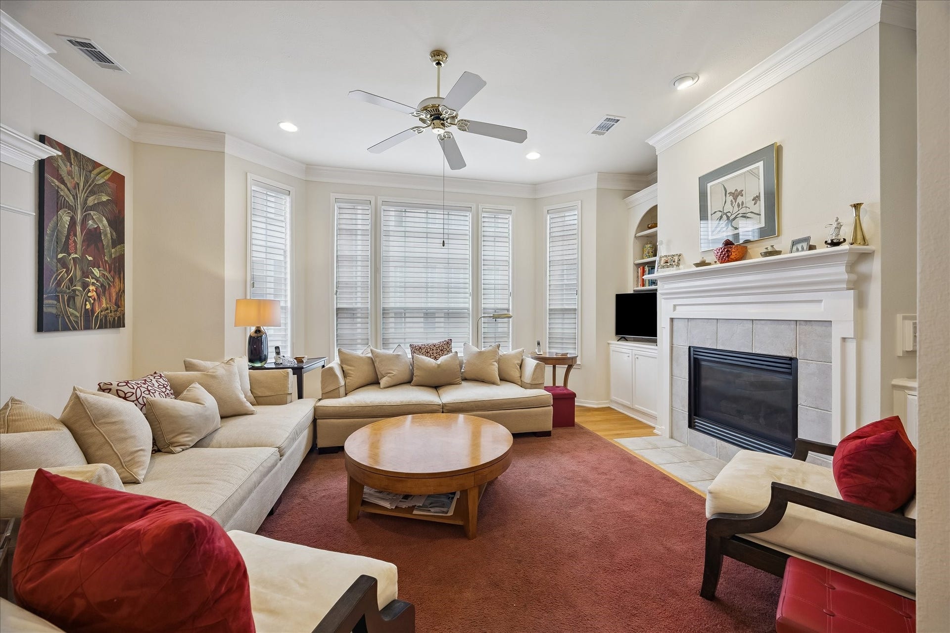 5213 Blossom Street, #A, Houston, TX 77007 Spacious living room w/ fireplace and built-ins beside fireplace.