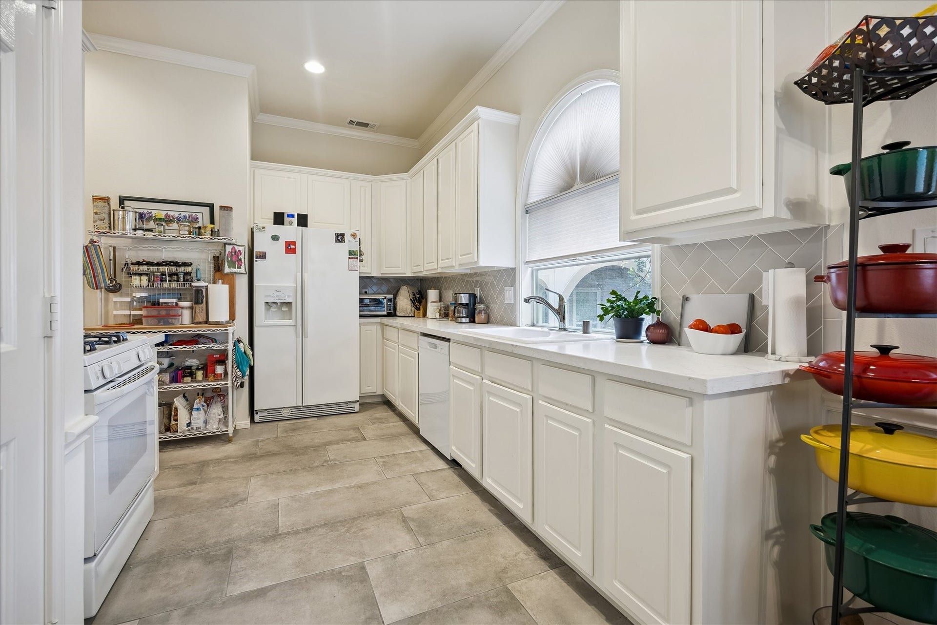 5213 Blossom Street, #A, Houston, TX 77007 Nice bright kitchen w/ plenty of counterspace & a pantry. Refrigerator included. Laundry room is just to the left of kitchen from this vantage point.