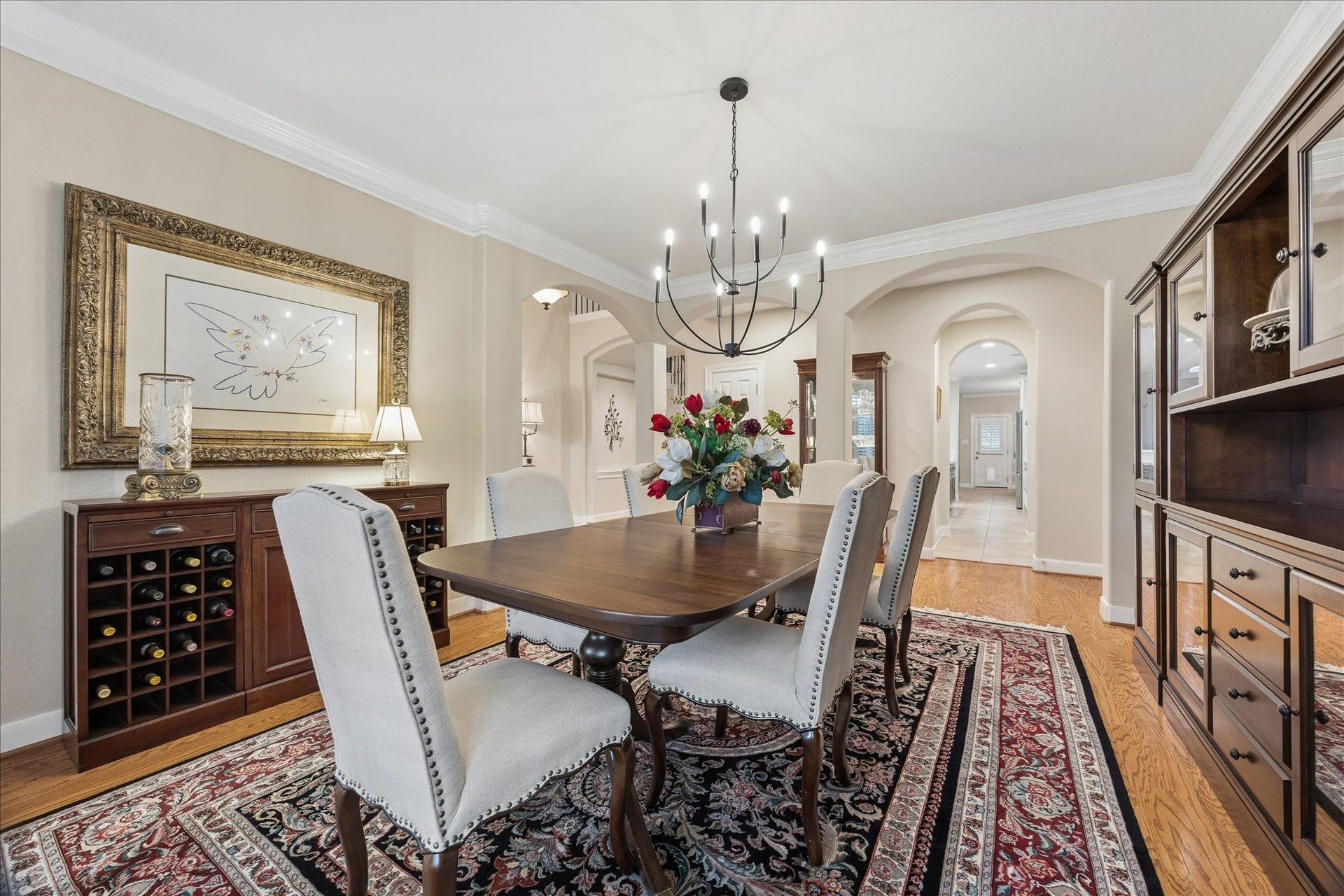 Host with ease in this thoughtfully appointed formal dining room, where seamless access to the butlers pantry keeps serving and entertaining a breeze.