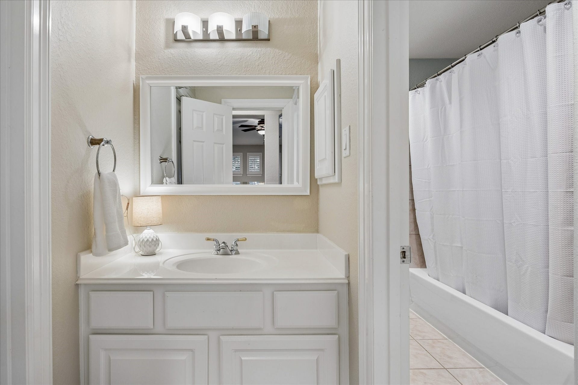 The opposite end of the Hollywood bath connects seamlessly to Bedroom 3, offering convenient access and a thoughtful flow between spaces.