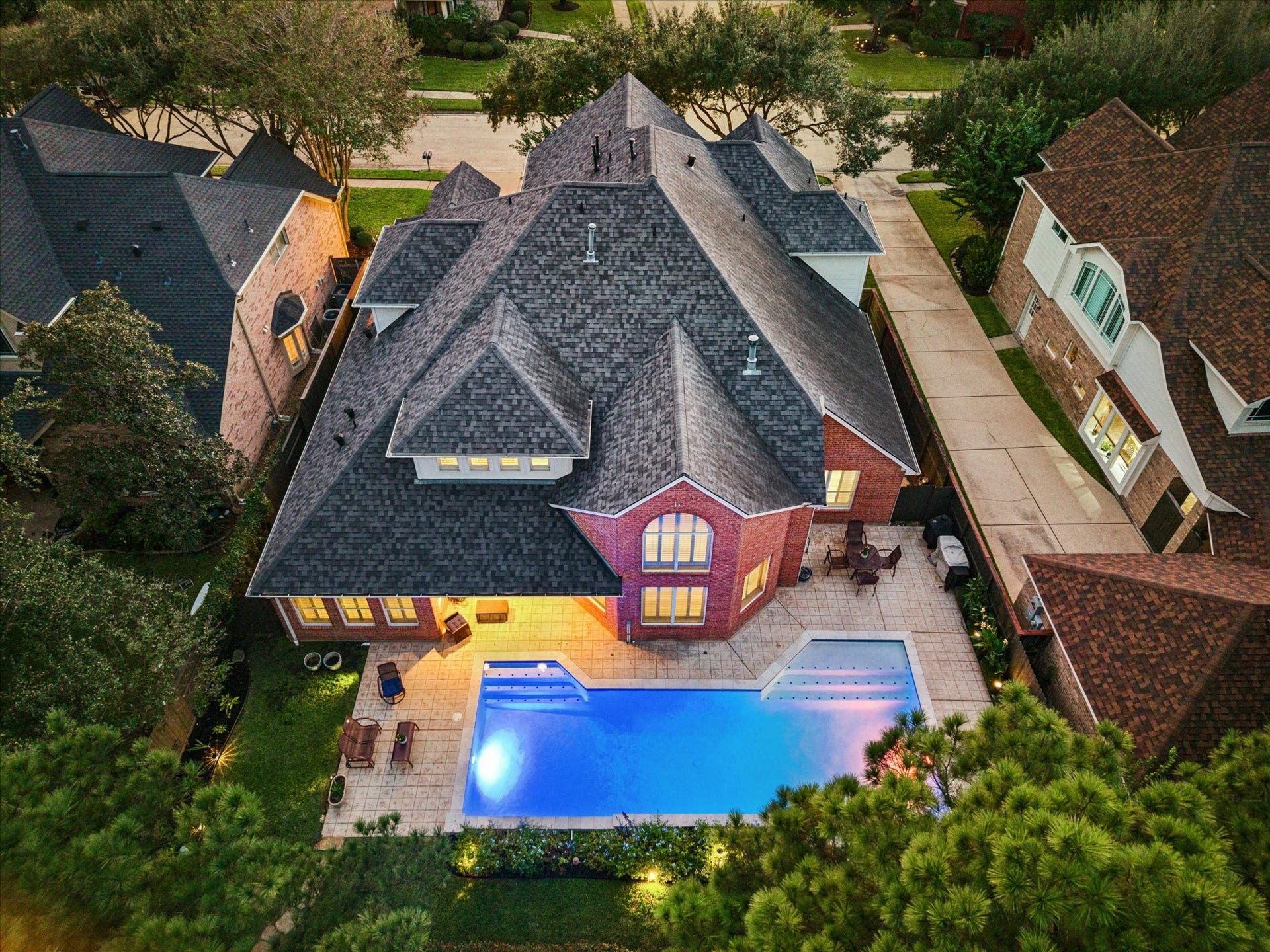 A covered patio opens to your private pool, extending outdoor living with direct access to the trail and peaceful greenbelt behind the home.