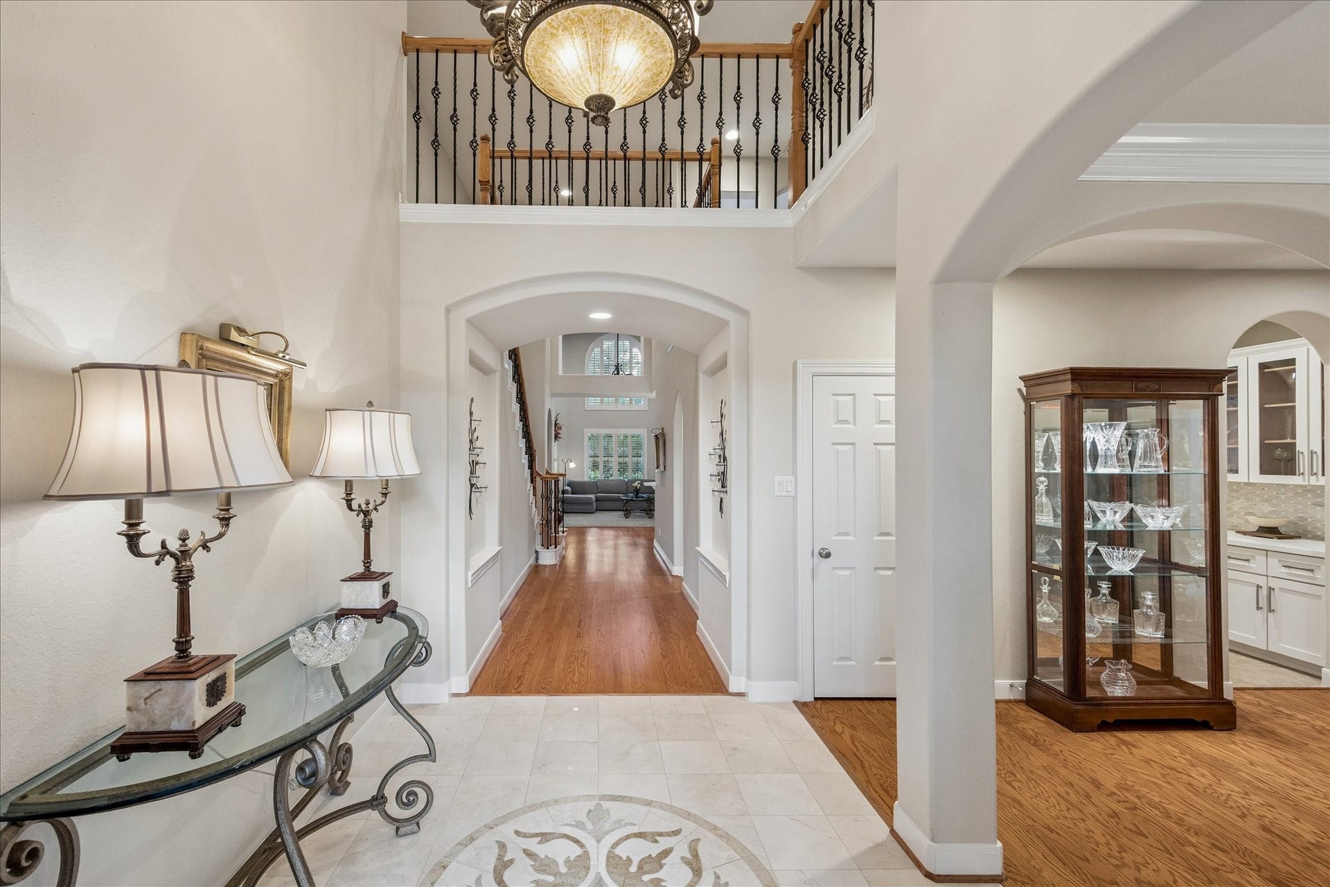 Step inside to soaring ceilings and gracefully curved archways that guide you through a light filled interior, creating an inviting sense of openness from the moment you arrive.